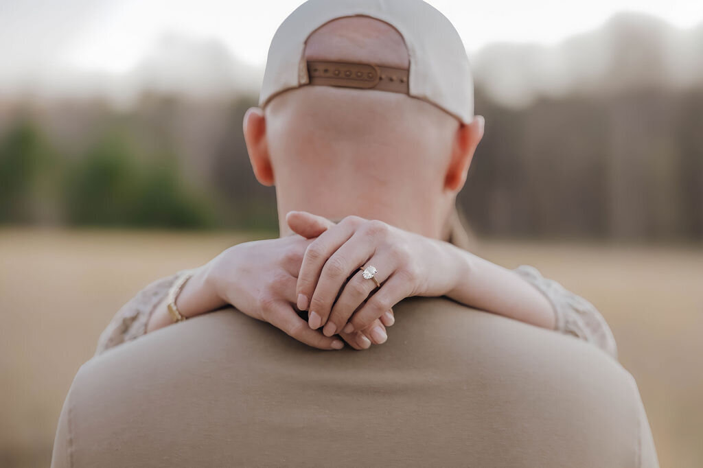 Classic engagement milestone session photo showing off the engagement ring in Charlotte NC