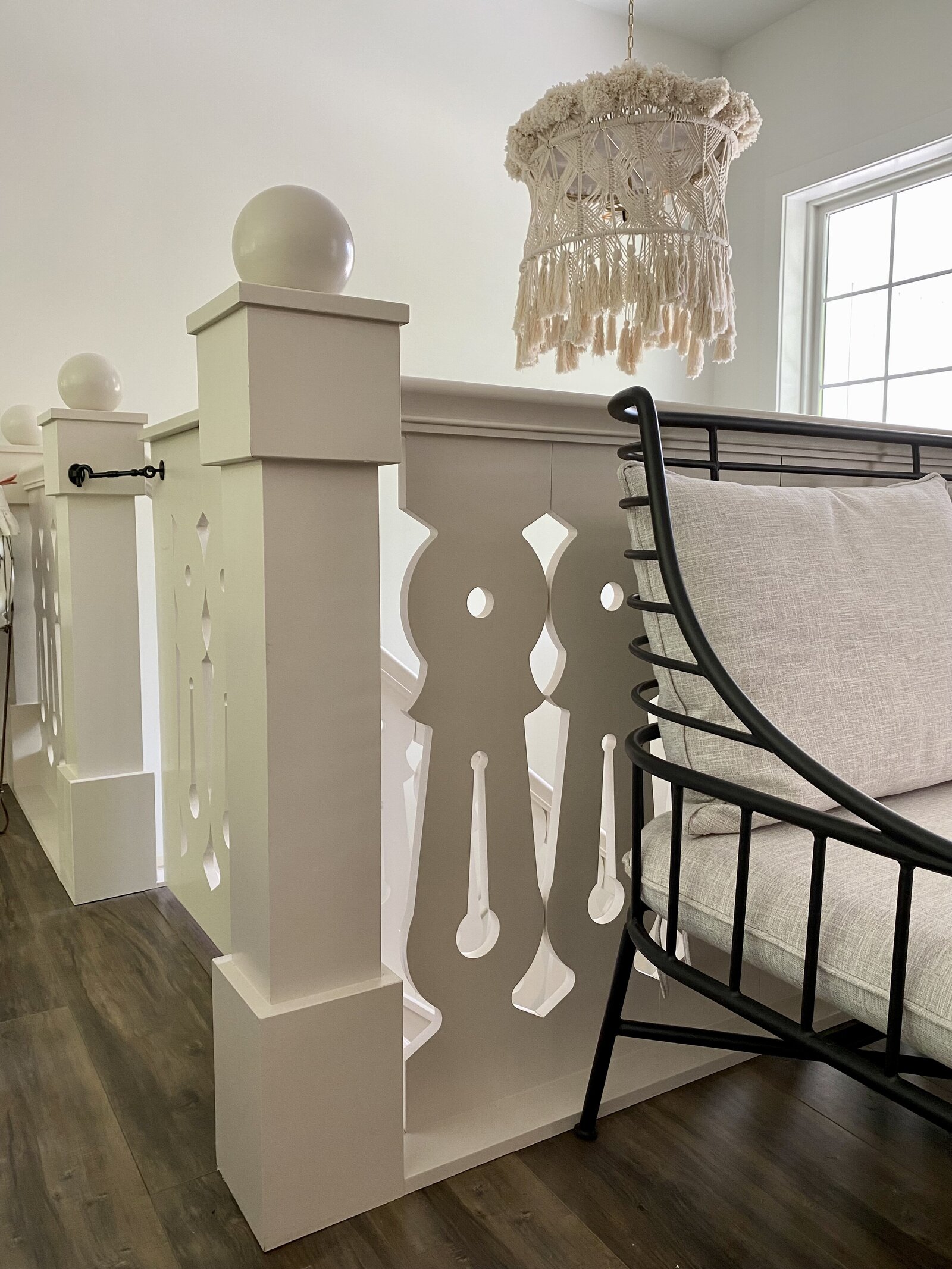 Newel post a stairway with flat sawn balusters.
