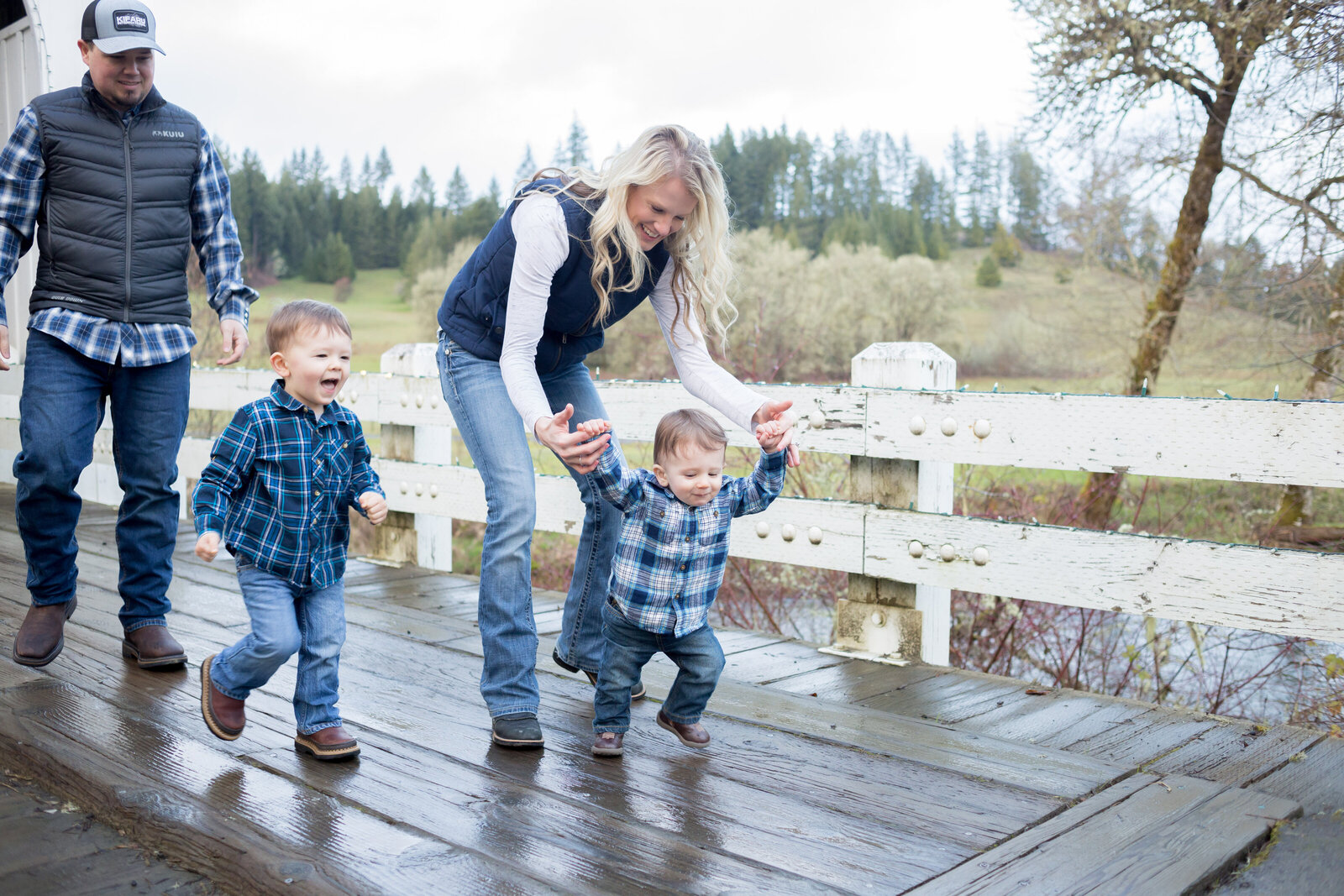 Seattle Wedding Photographer captures family walking together on bridge