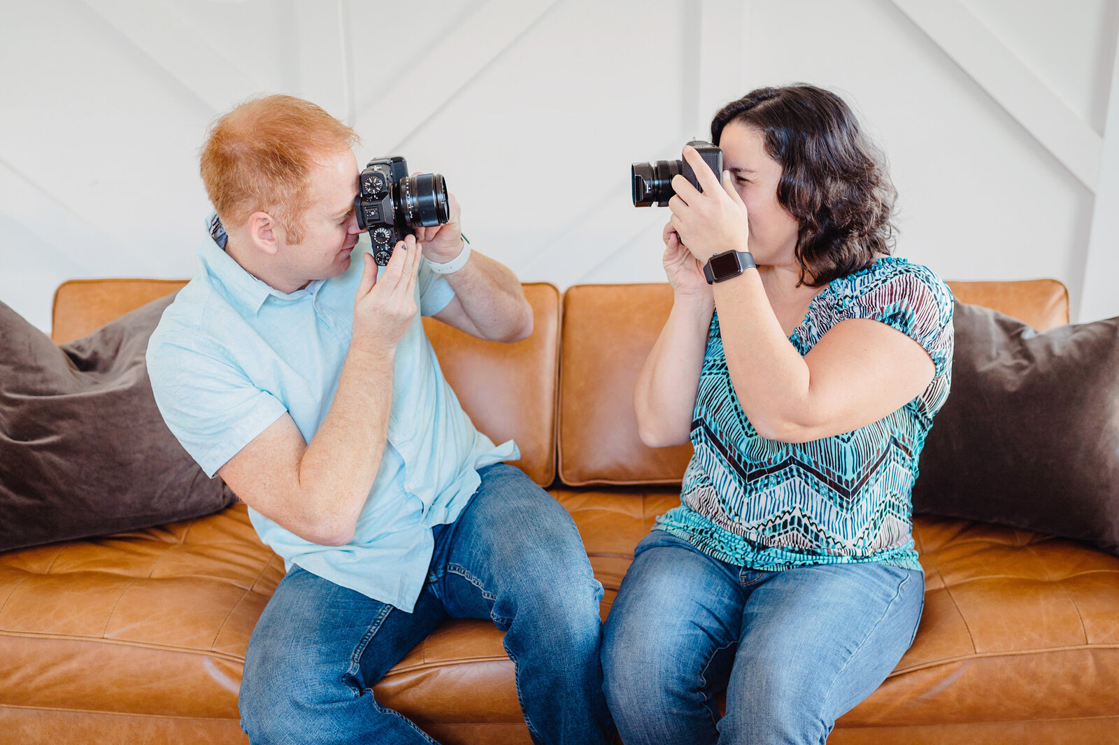 Kevin and Renee taking photos of each other on a brand session