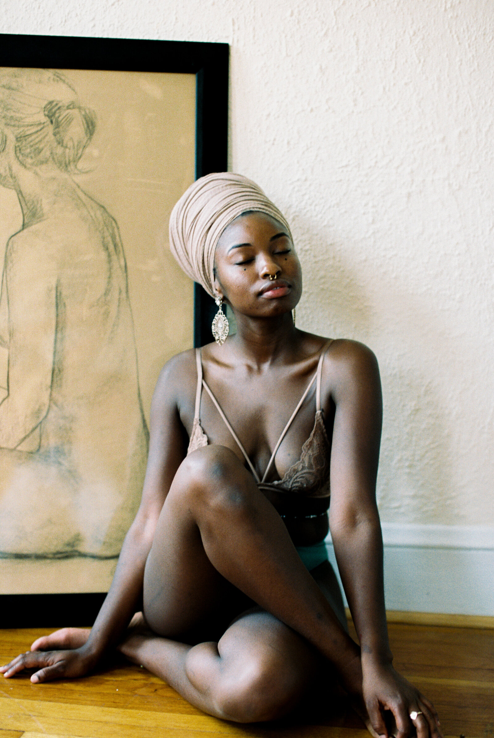Boudoir photo of a black woman wearing a headwrap