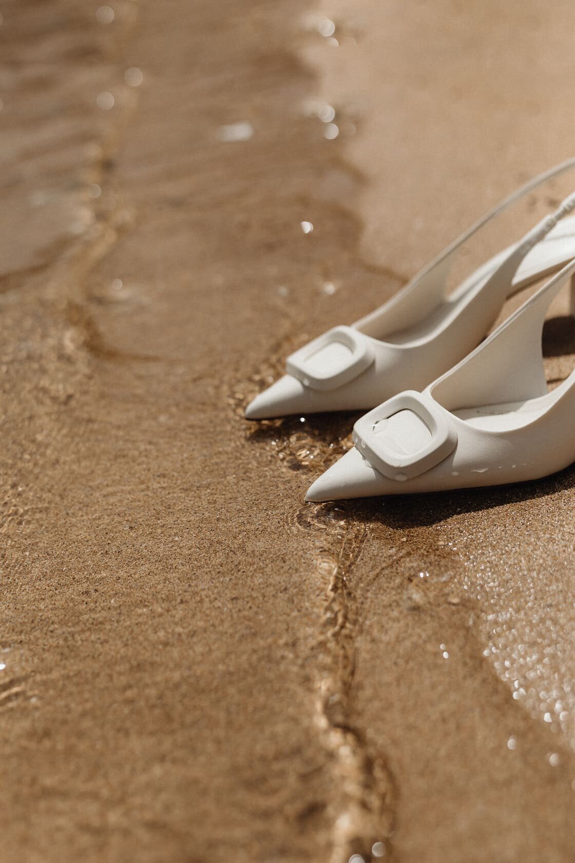 kaboompics_white-high-heeled-open-back-pumps-with-front-embellishment-pointed-toe-ankle-strap-with-elastic-insert-31427