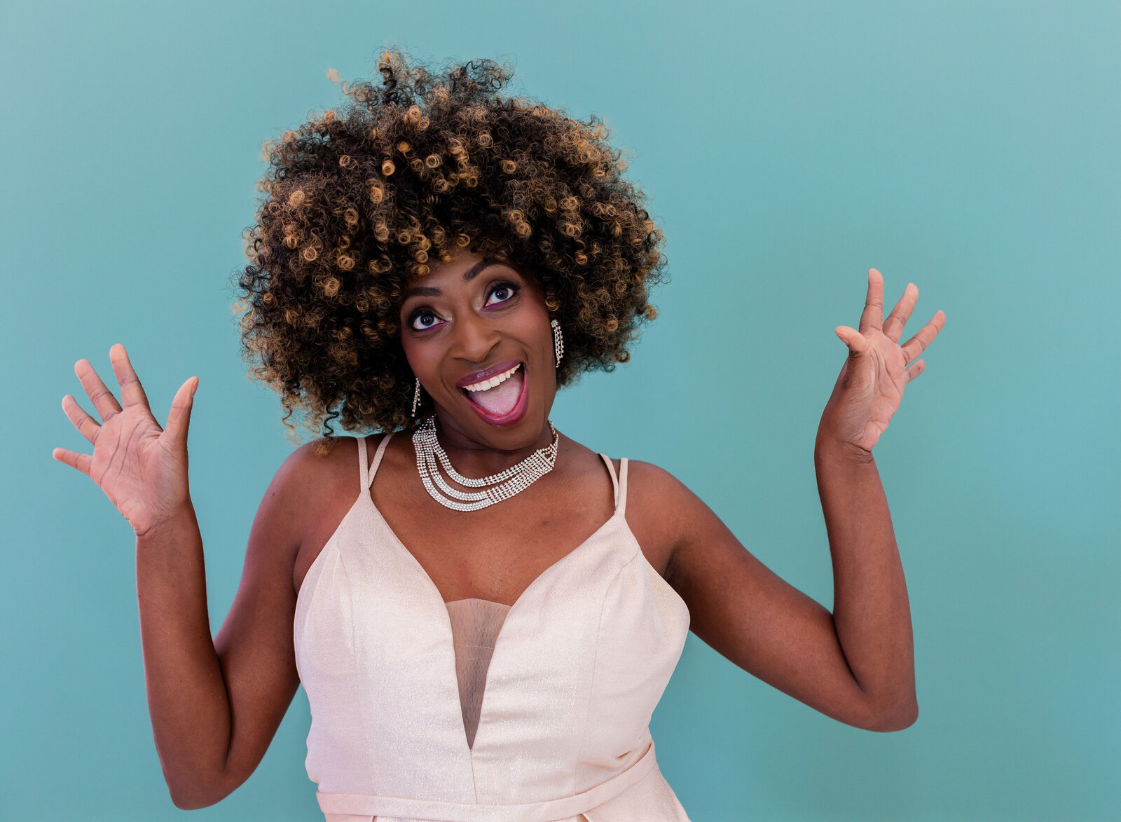 woman being silly with hands up
