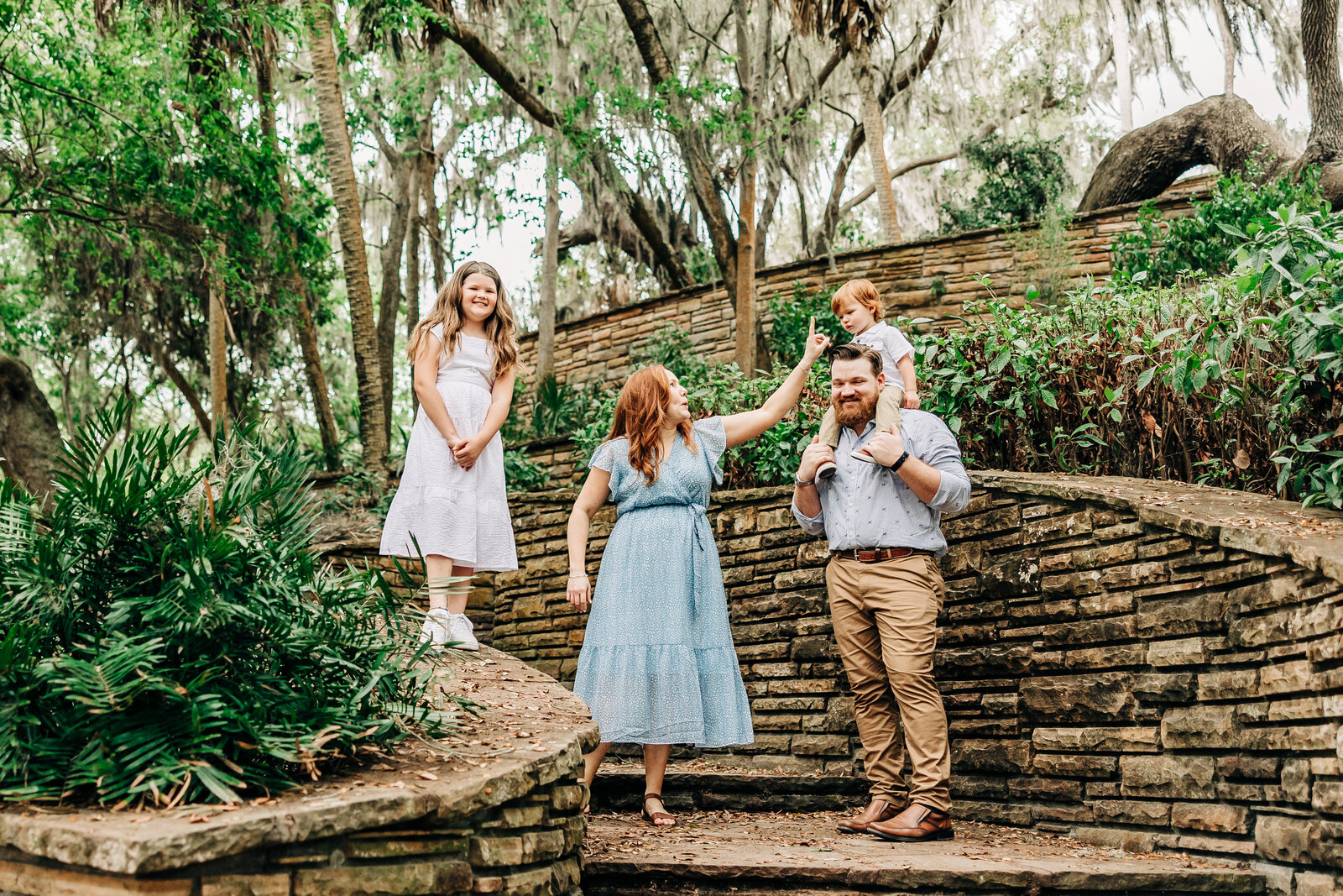 Fun style family photographer with older kids playfully near st. pete