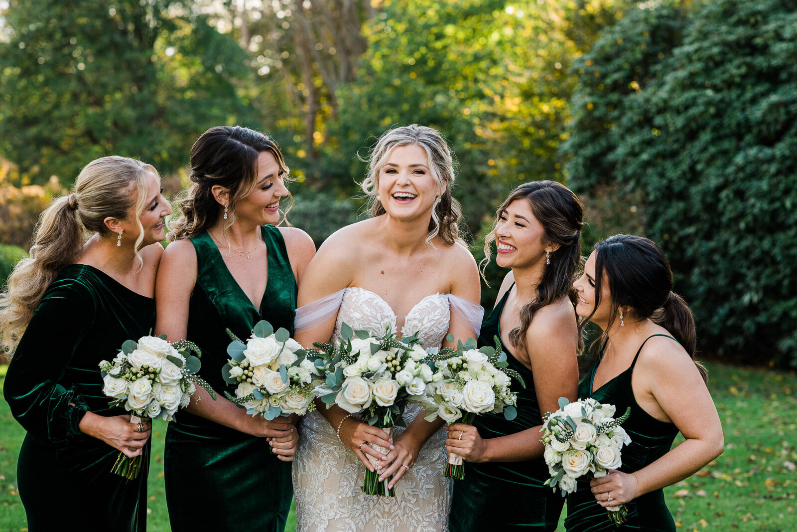 bride and bridesmaid laughing portrait