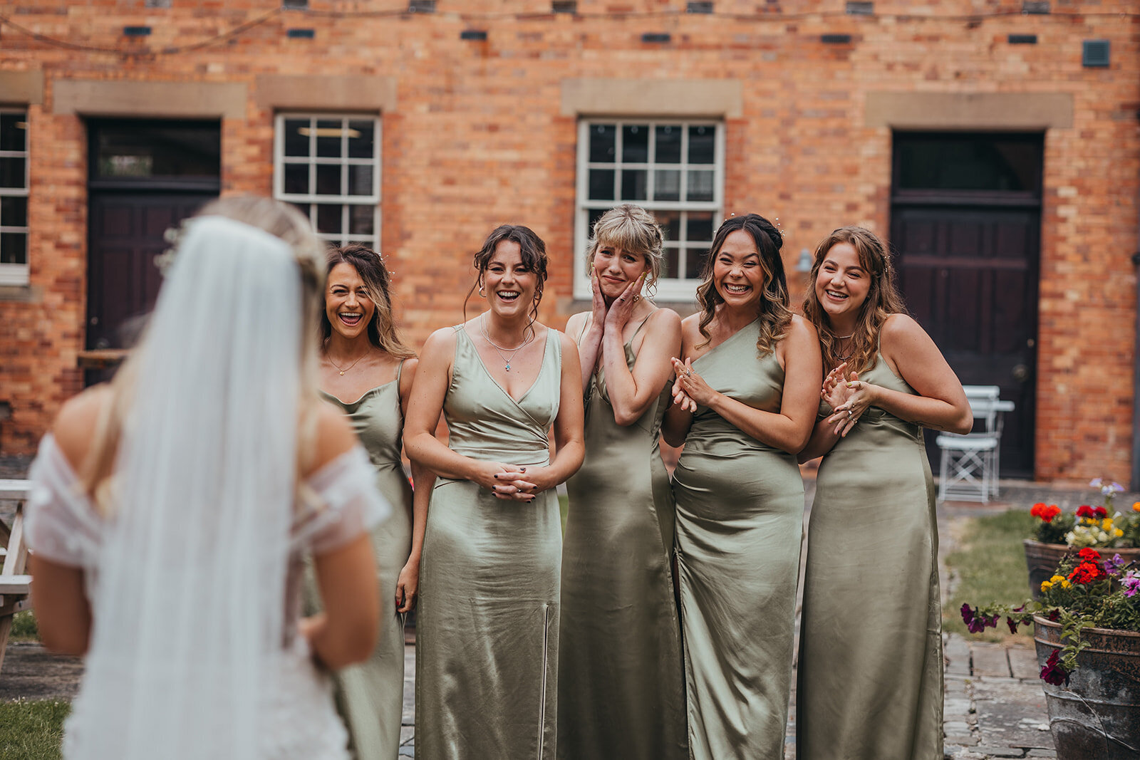 bridesmaids react to seeing bride