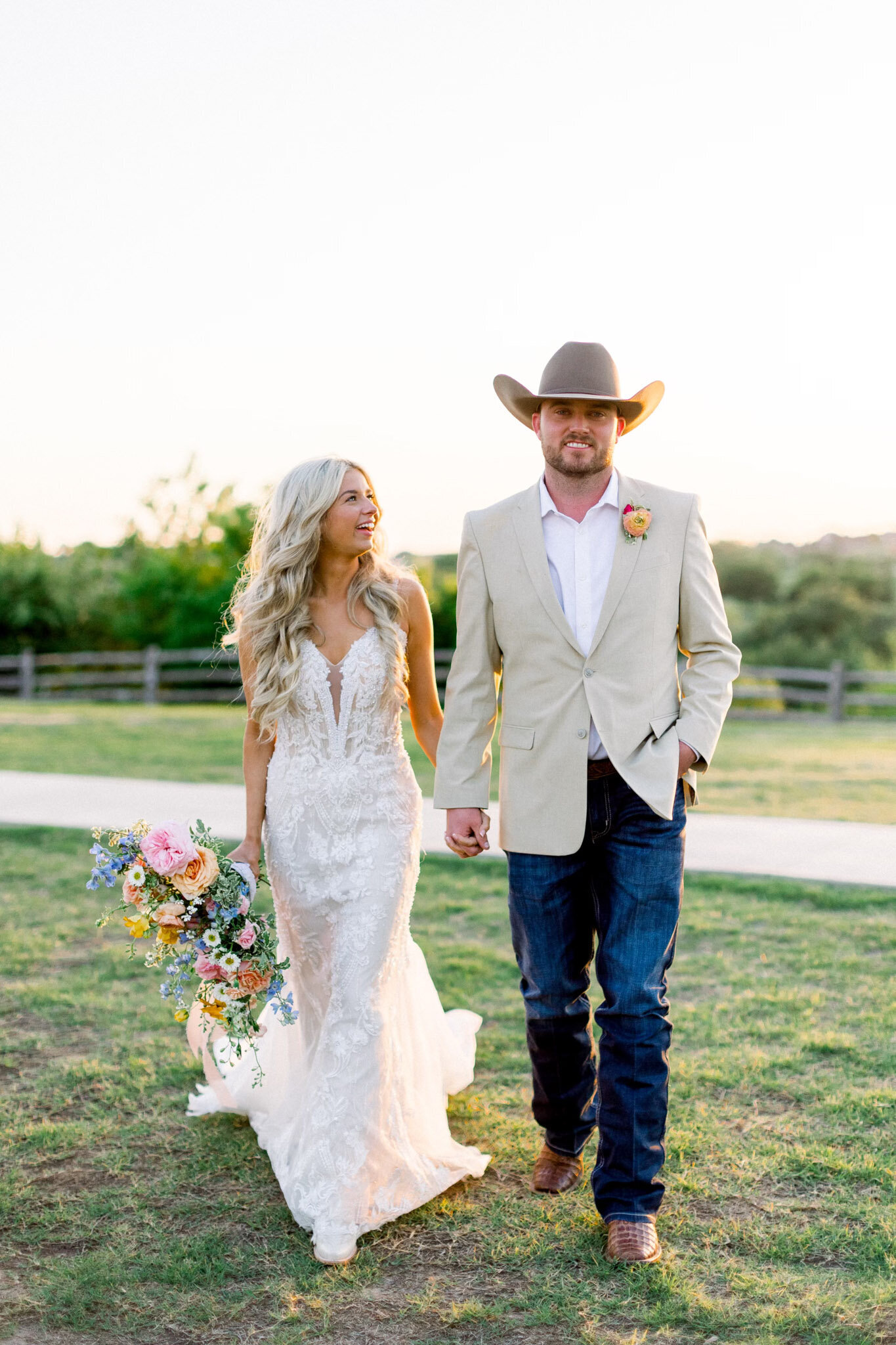 texas bride and groom holding hands