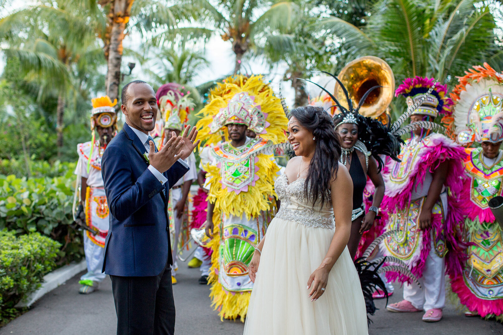 Bride and groom with people wearing colorful tribe costumes