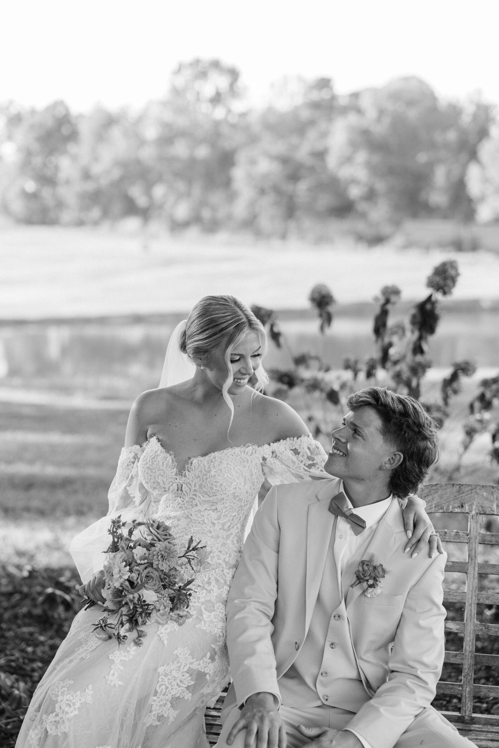 Couple-looking-at-each-other-Hayfield-at-Murchison-Farms