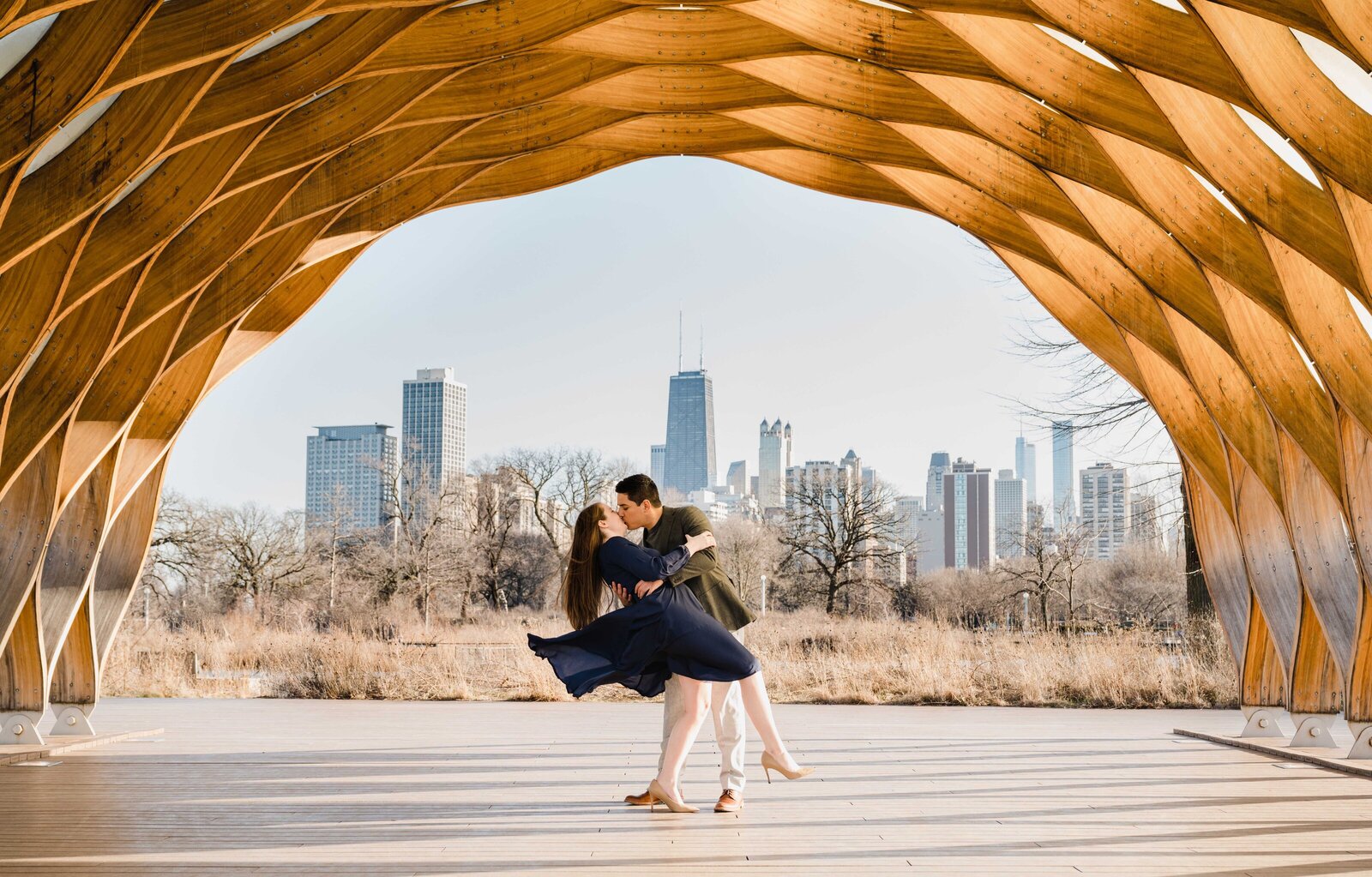 Couple dipping at honeycomb sculpture in Lincoln Park