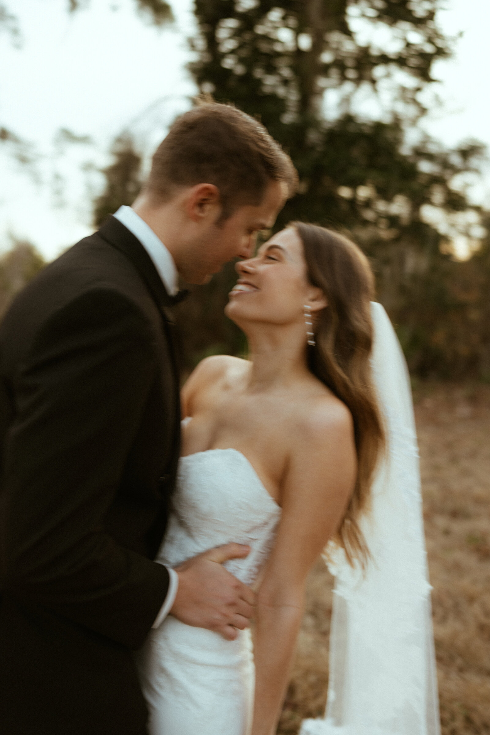Wedding couple dancing in a field