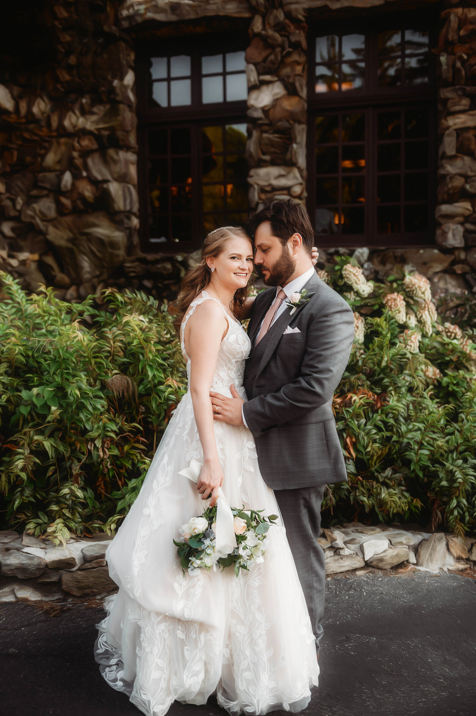 Bride and Groom embrace for Newlywed Portraits after their Micro Wedding Ceremony at Grove Park Inn in Asheville, NC.