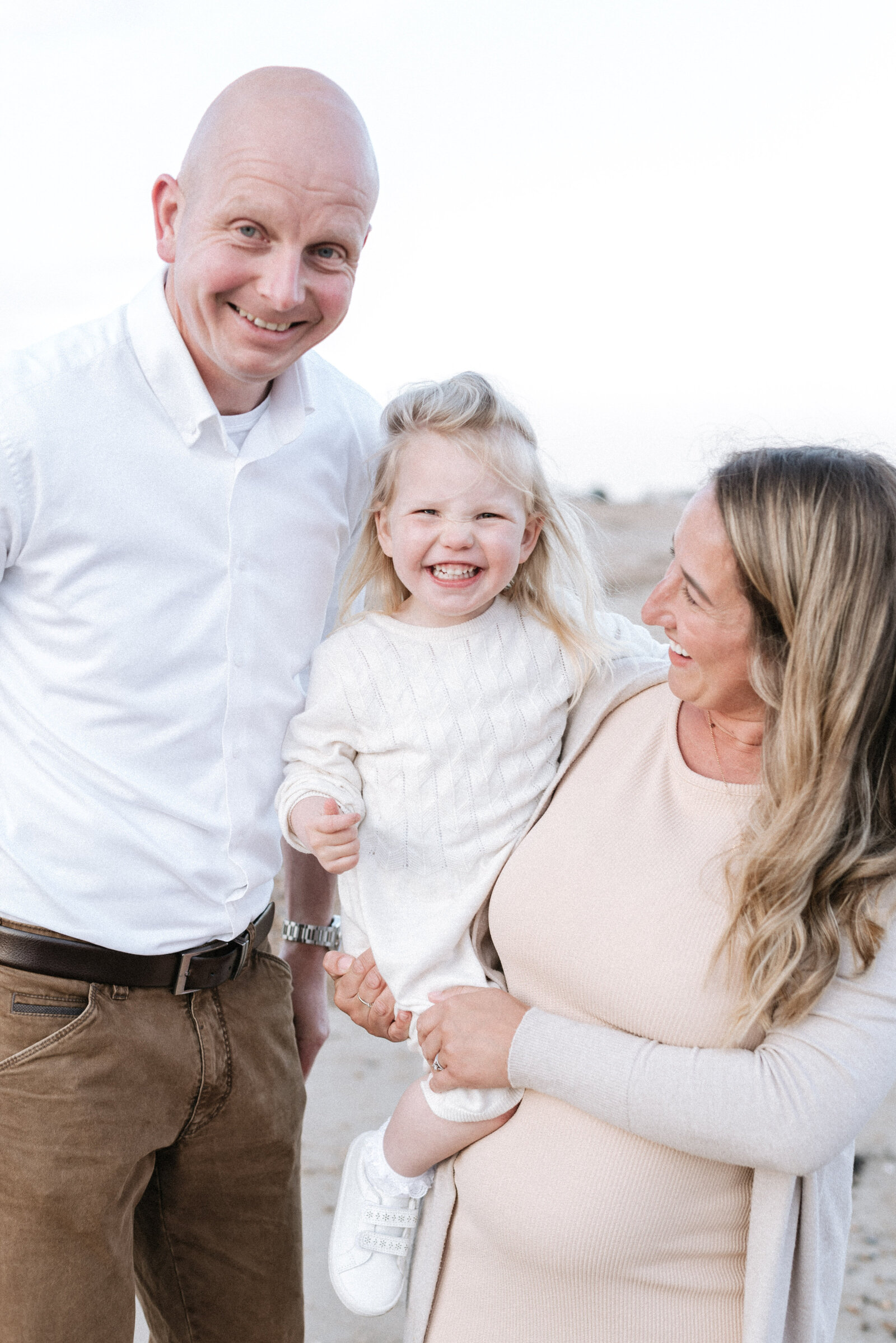 Goring west sussex family photoshoot with a family of 3 smiling