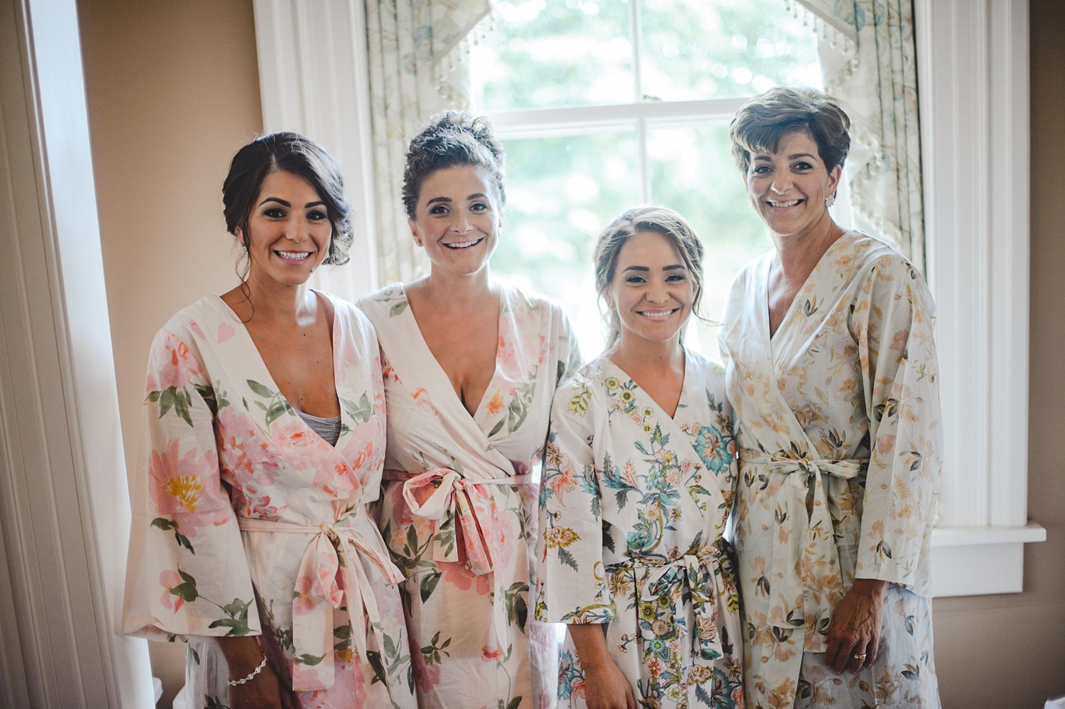 Bride and bridesmaids in custom getting ready robes