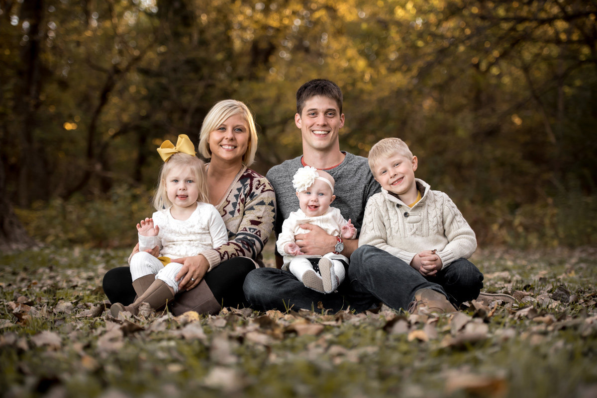 family-in-autumn-leaves