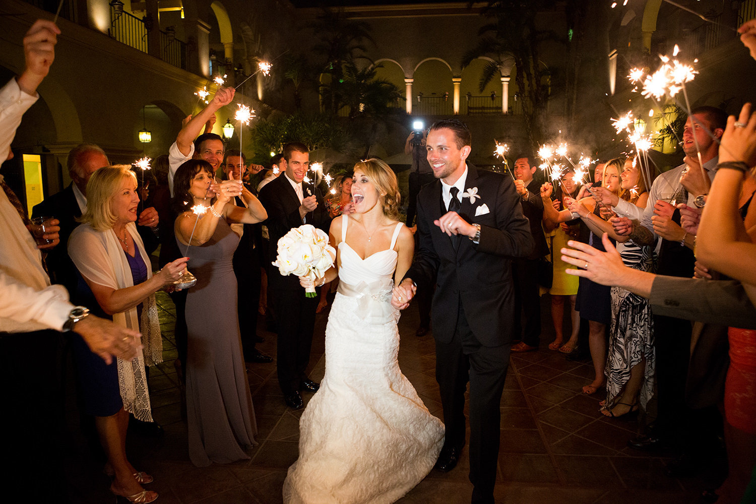 stunning night shot at balboa park prado wedding with sparklers