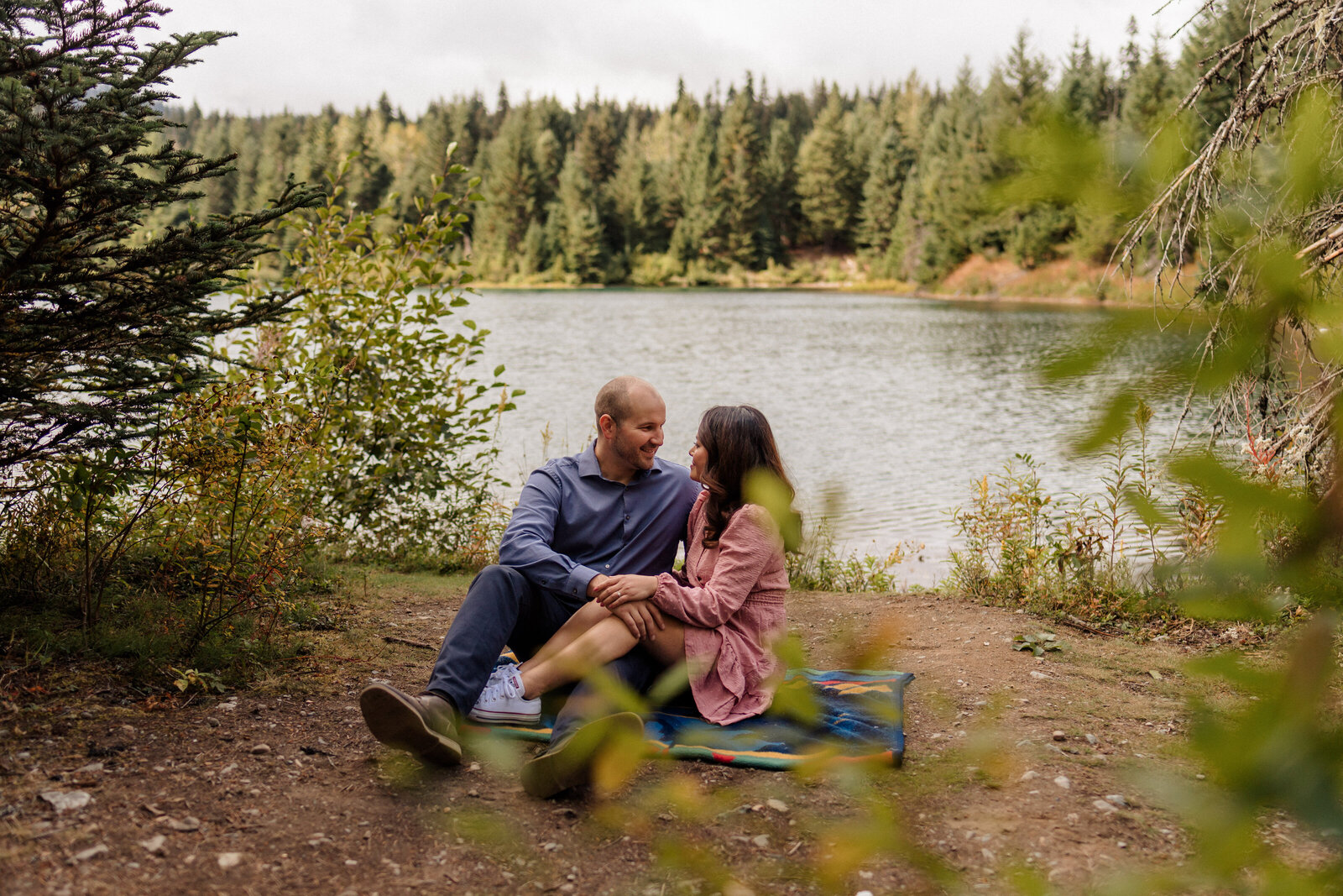 Couple sitting on a blanket during their Snoqualmie, WA engagement session