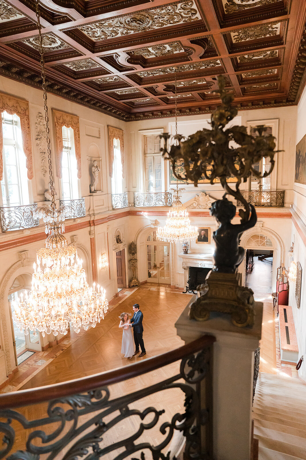 Engaged couple dancing in the grand ballroom of Larz Anderson House during elegant Washington DC engagement session