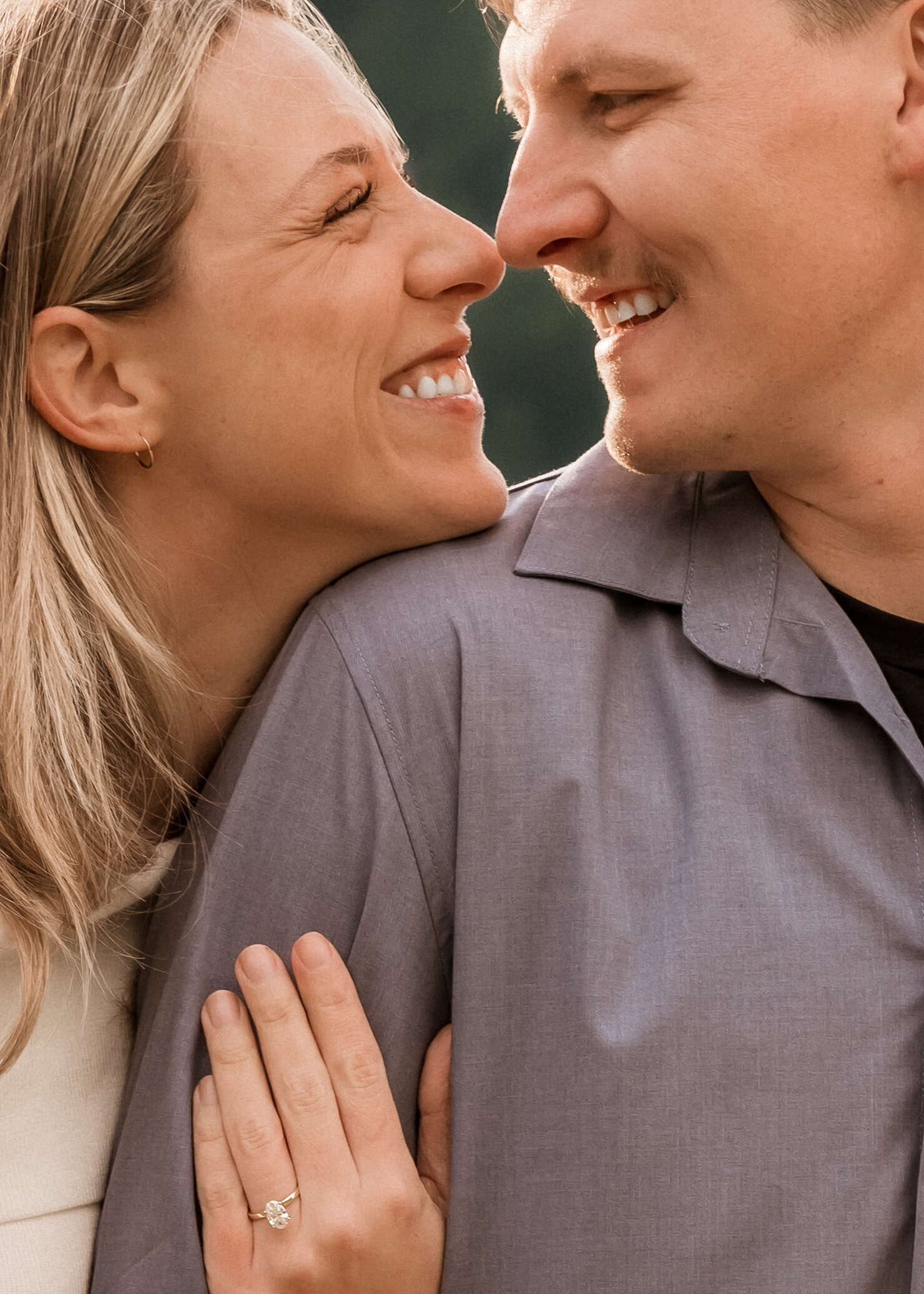Couple snuggling up for engagement photos in the Columbia River Gorge.