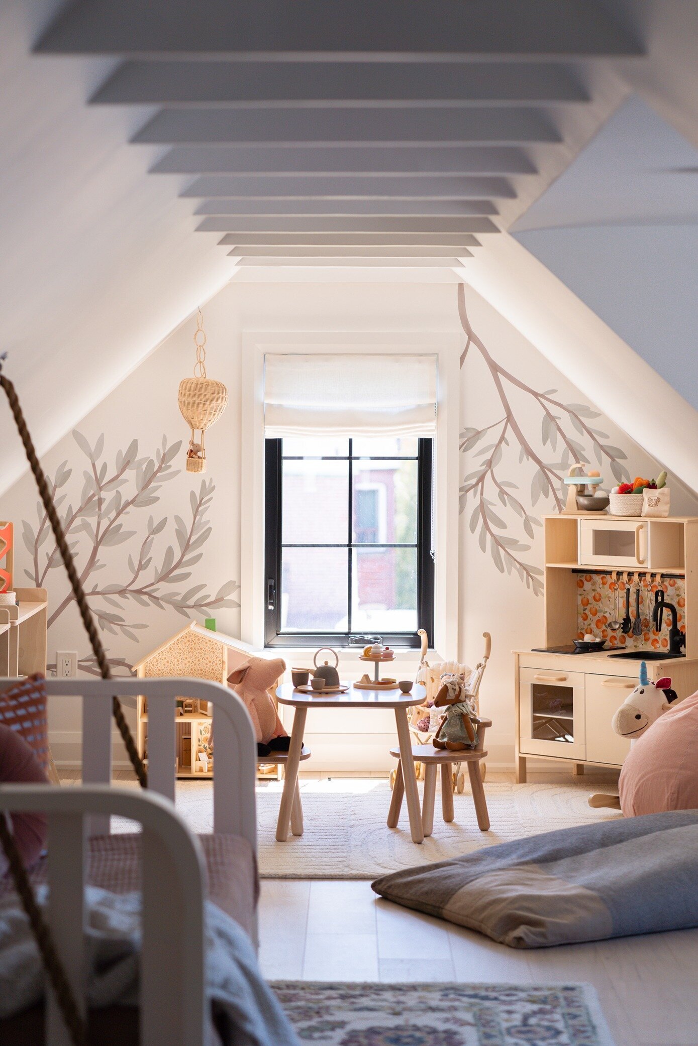 Kids playroom design with nature inspired wallpaper 