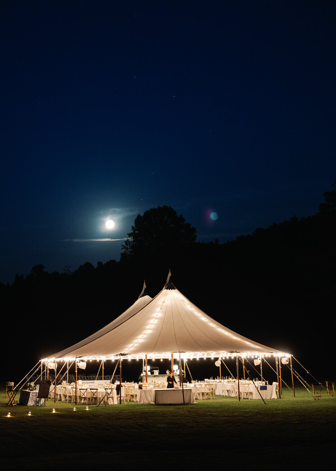 Wedding Reception Tent with lights and moon glowing in the background at Glen Ella