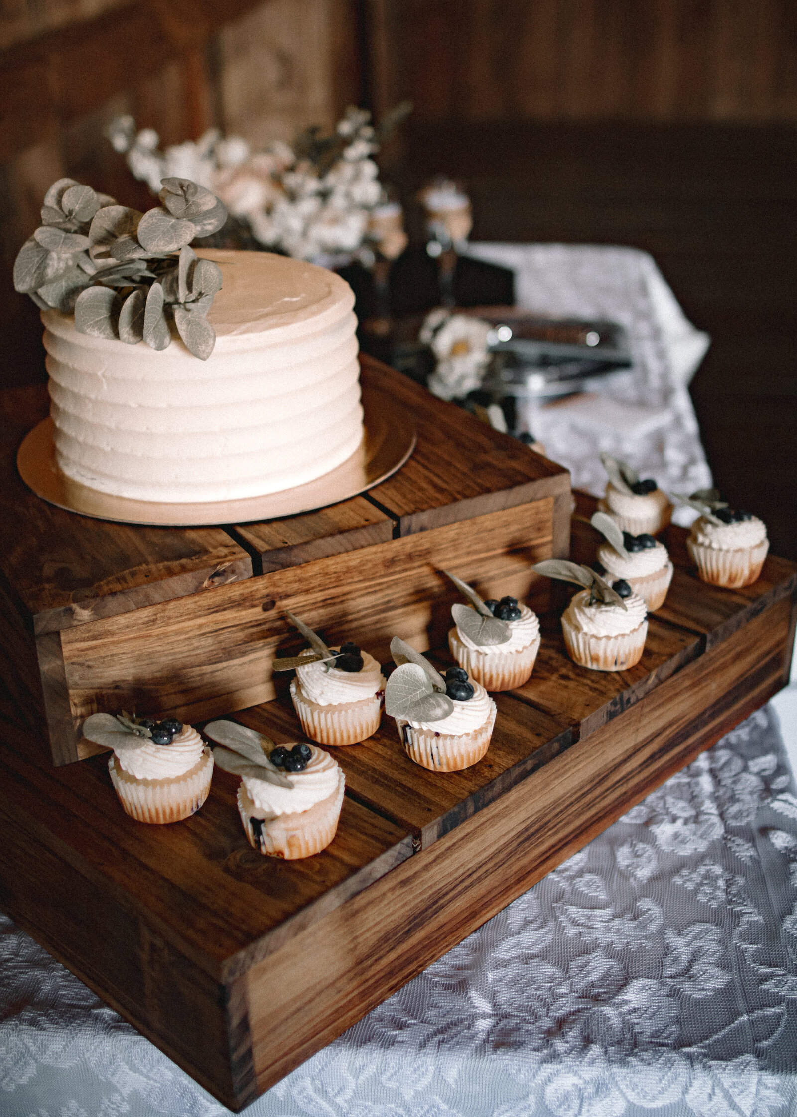 Wedding Cake with Cup Cakes around it