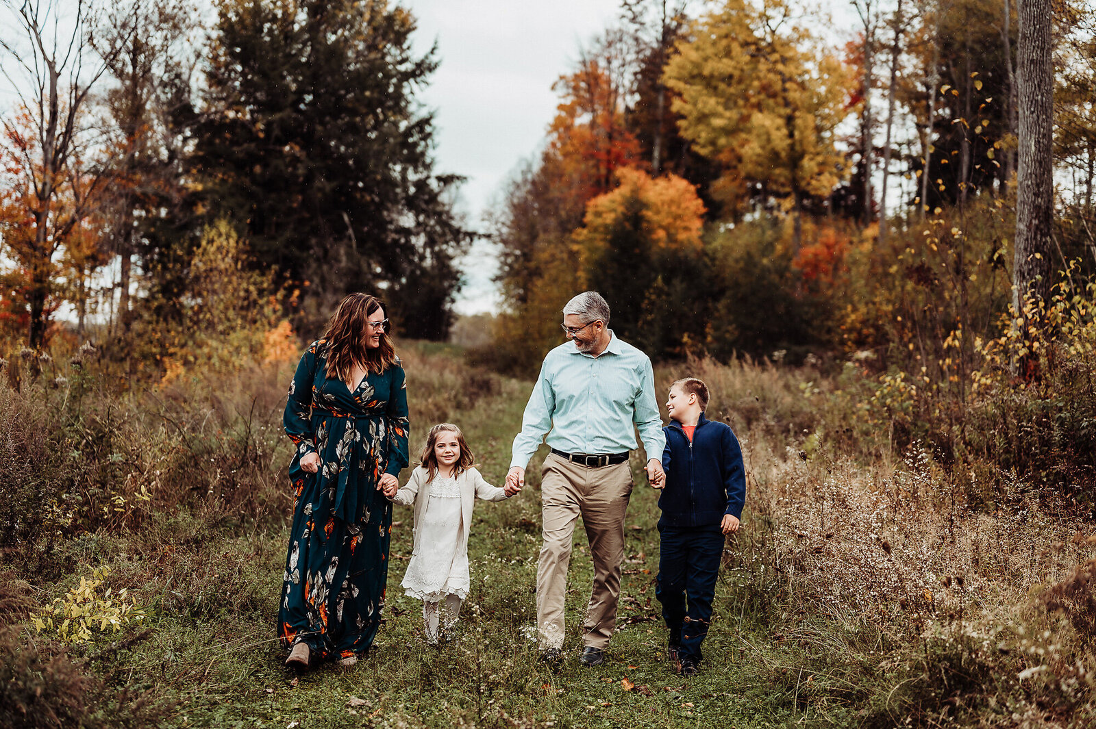 Warren PA Fall Family Session with family walking towards the camera