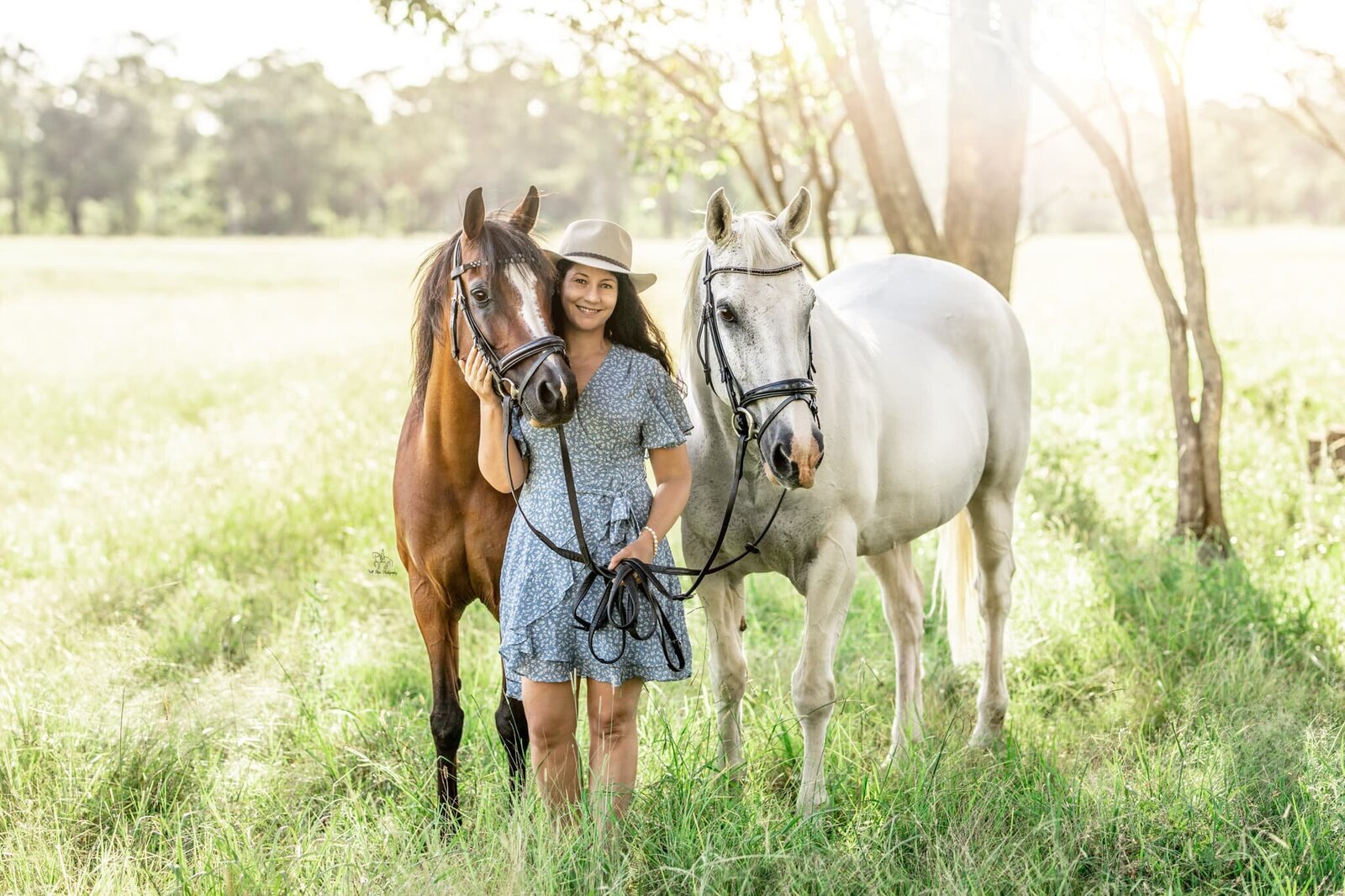 (49) Two horses and owner in equine photoshoot