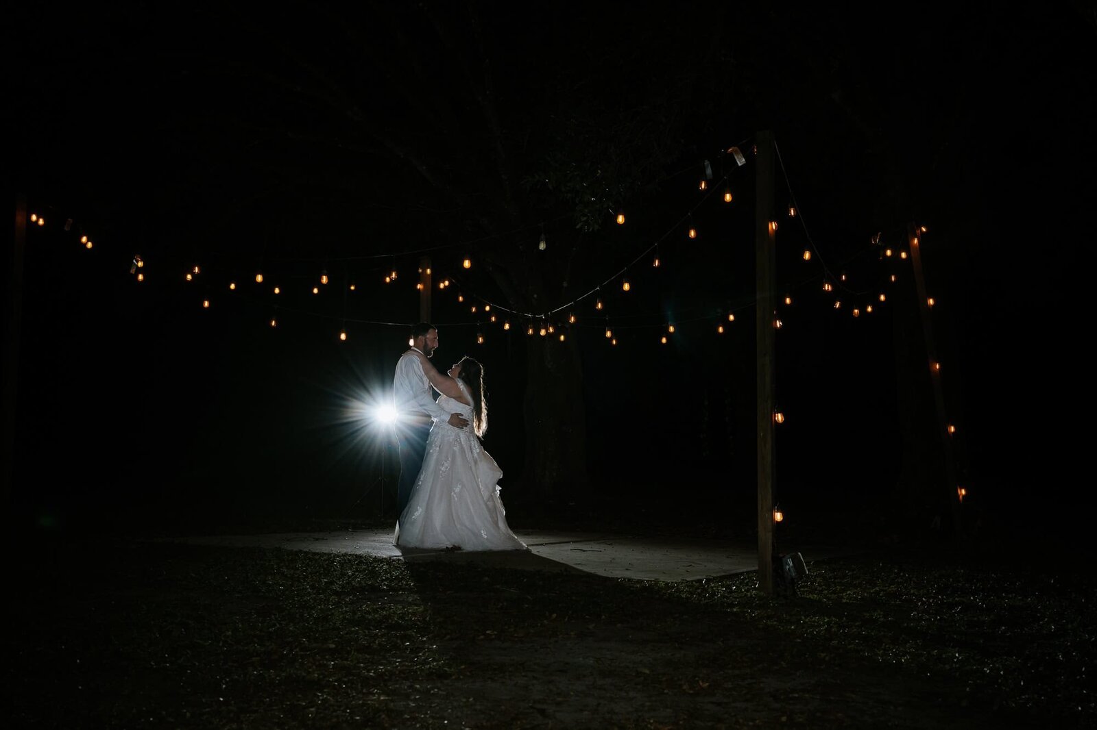 Ever after farms citrus barn - couple enjoying their intimate first dance outside 