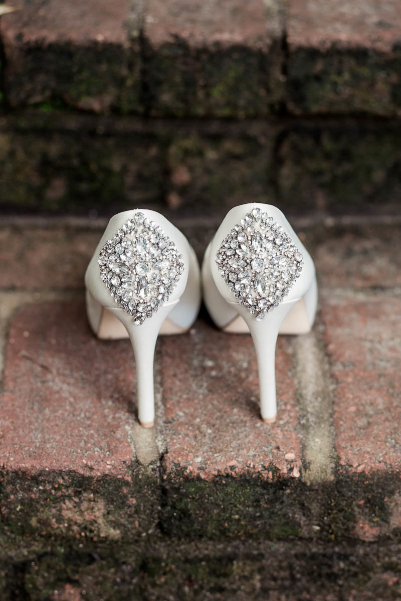 The bride's shoes sit on brick step, Magnolia Plantation, Charleston Wedding Photographer.