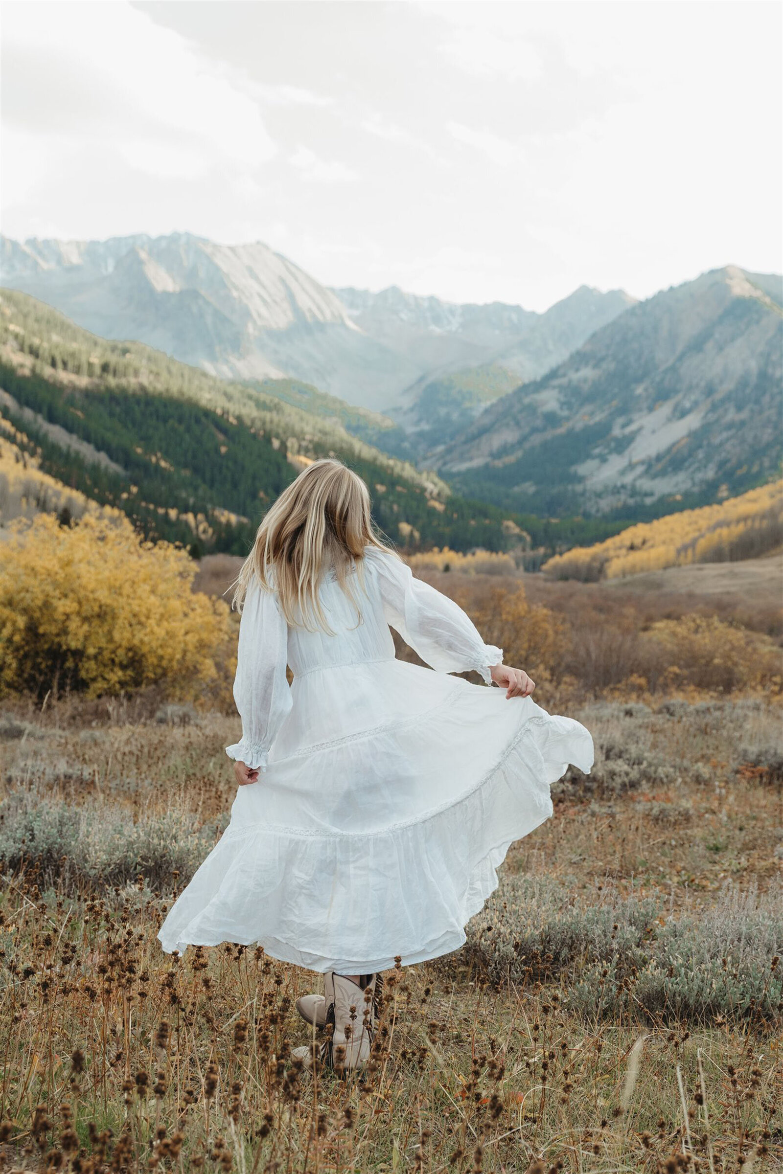 Editorial-style Aspen couples portrait — classic layers and refined textures styled against the Rocky Mountain backdrop.