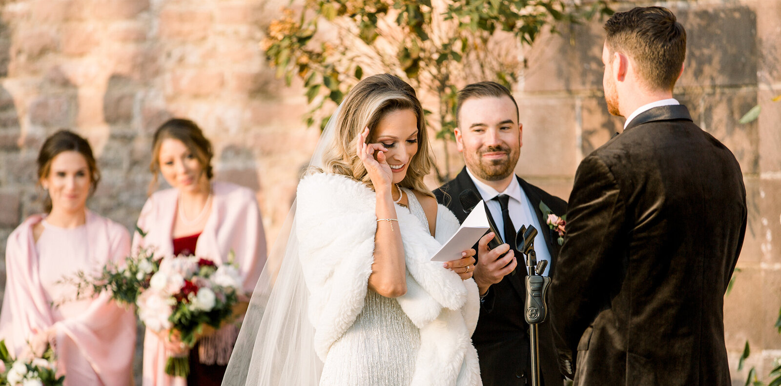 bride wiping away a tear in her Philadelphia wedding photos