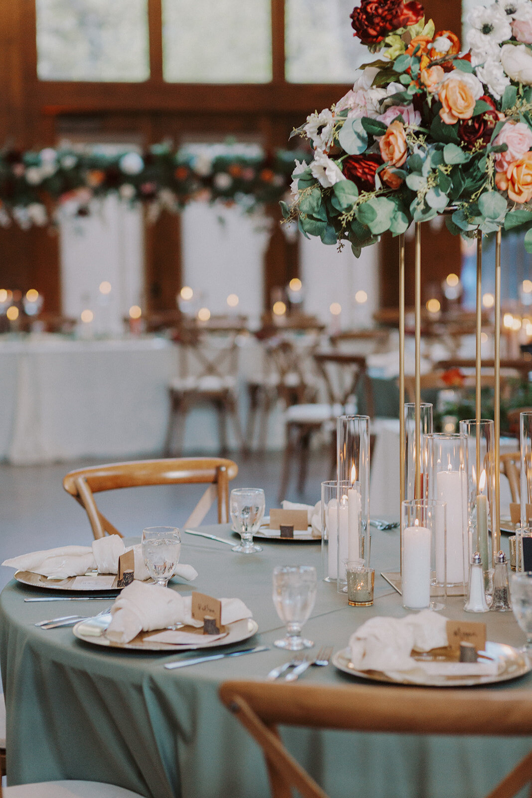 Wedding reception round table with floral centerpiece