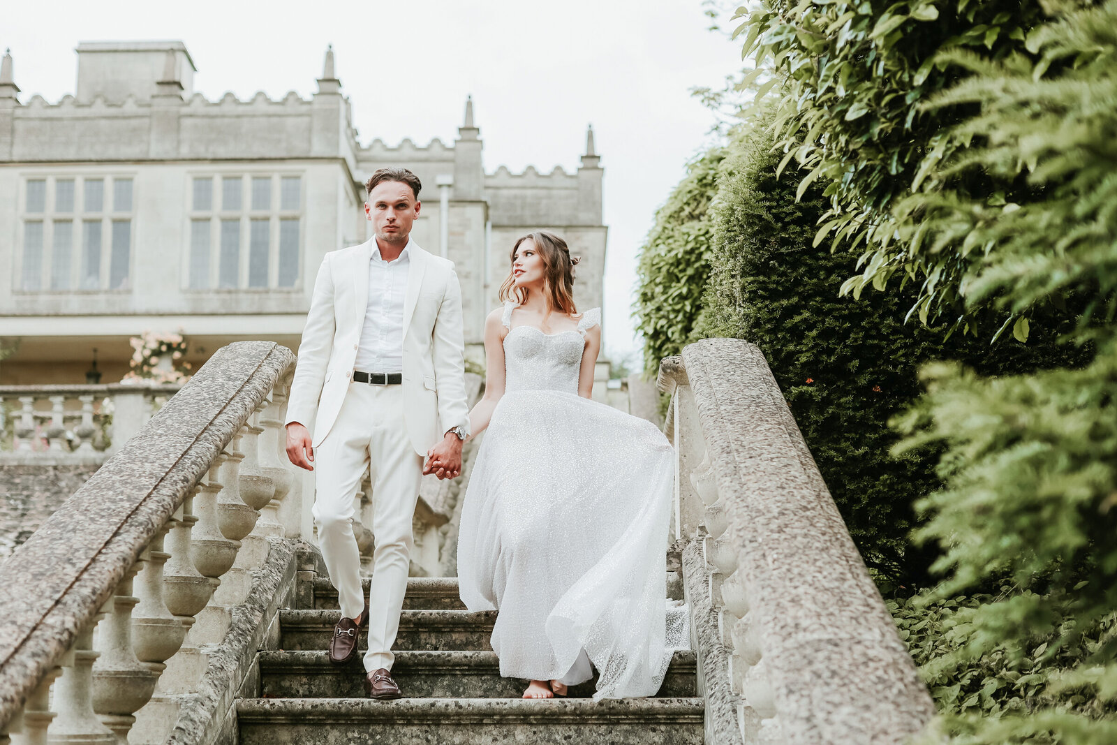 Euridge-Manor-wedding-couple-walking-downstairs