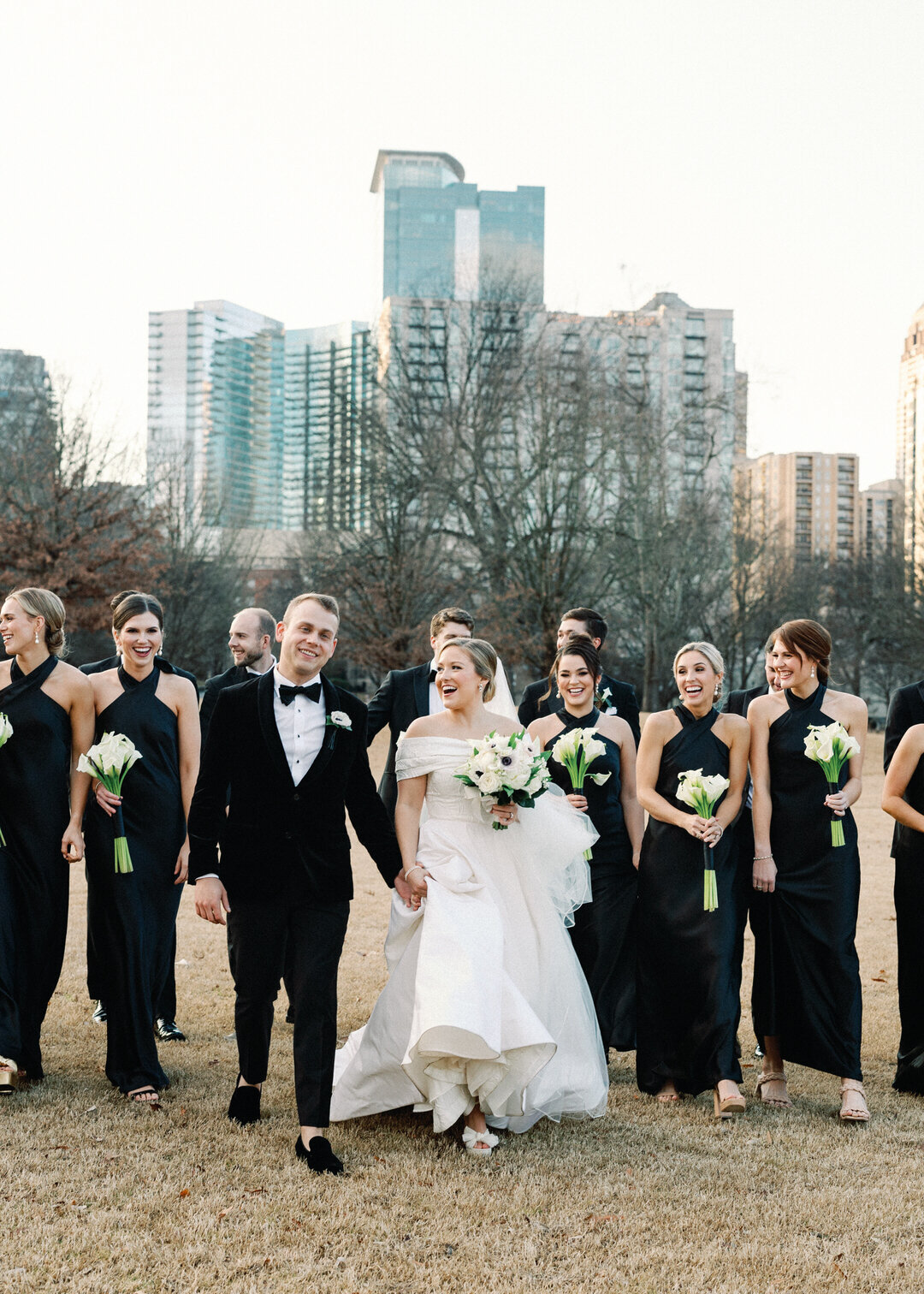 Bride and Groom with Bridesmaids and Groomsmen walking in Piedmont Park in Atlanta