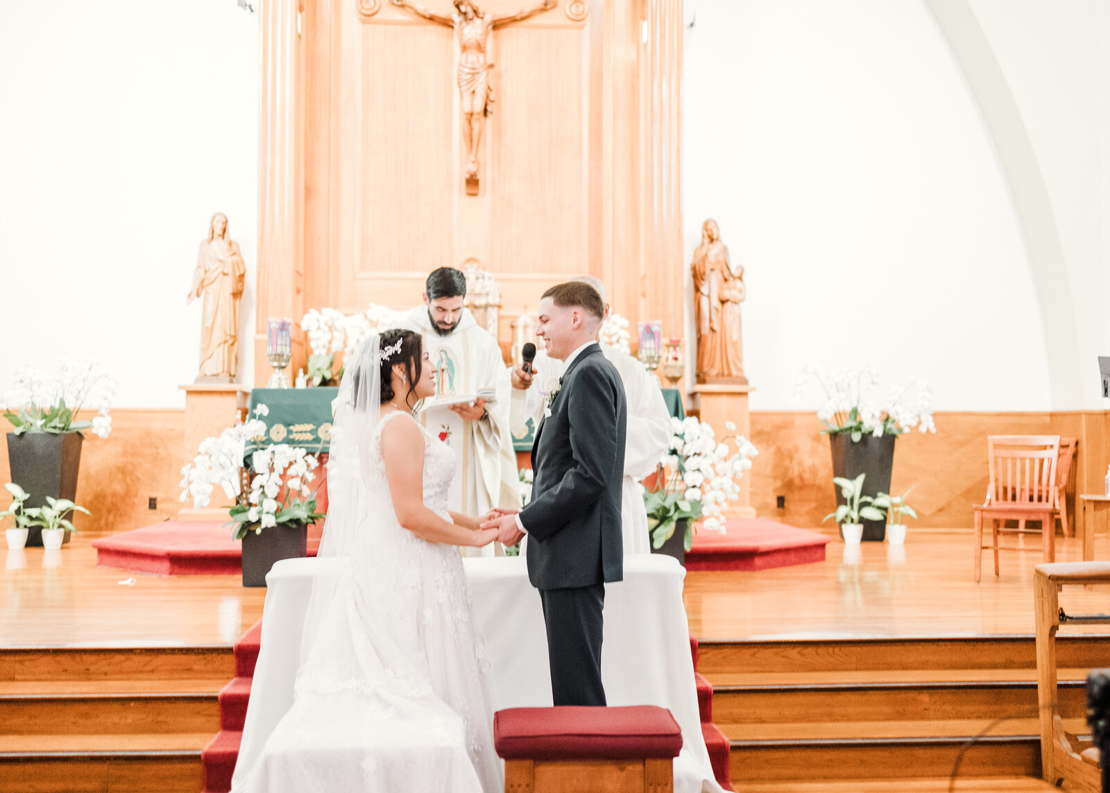 Bride and Grrom exchanging vows at Saint Anne's Catholic Church in Santa Ana