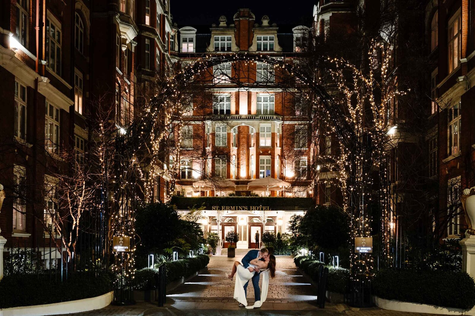 Couple kissing in front of St Ermin's Hotel in London moments after she said "YES" to the big question.