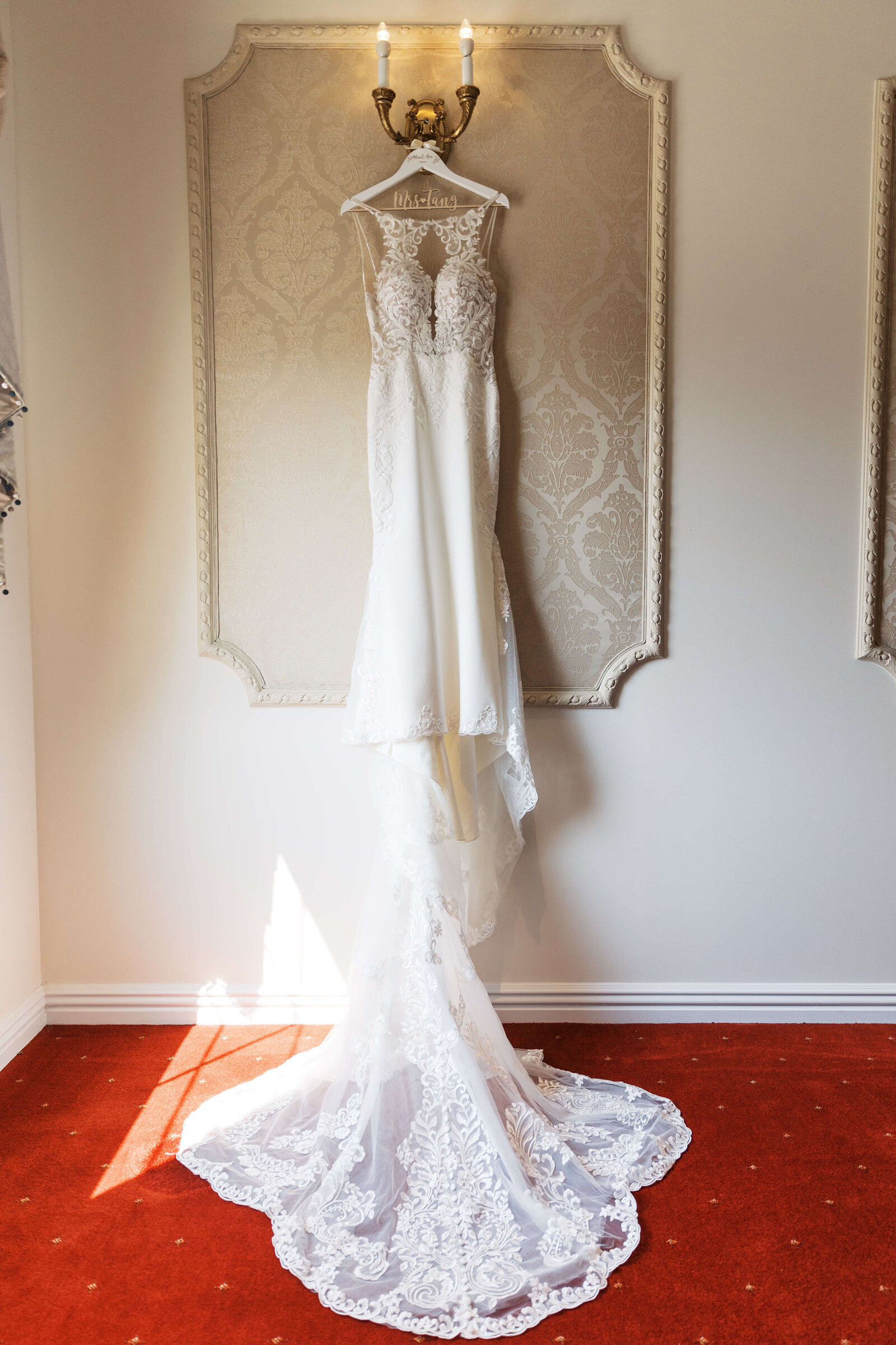 Bridal gown hanging in the stairway at Palace at Somerset Park.