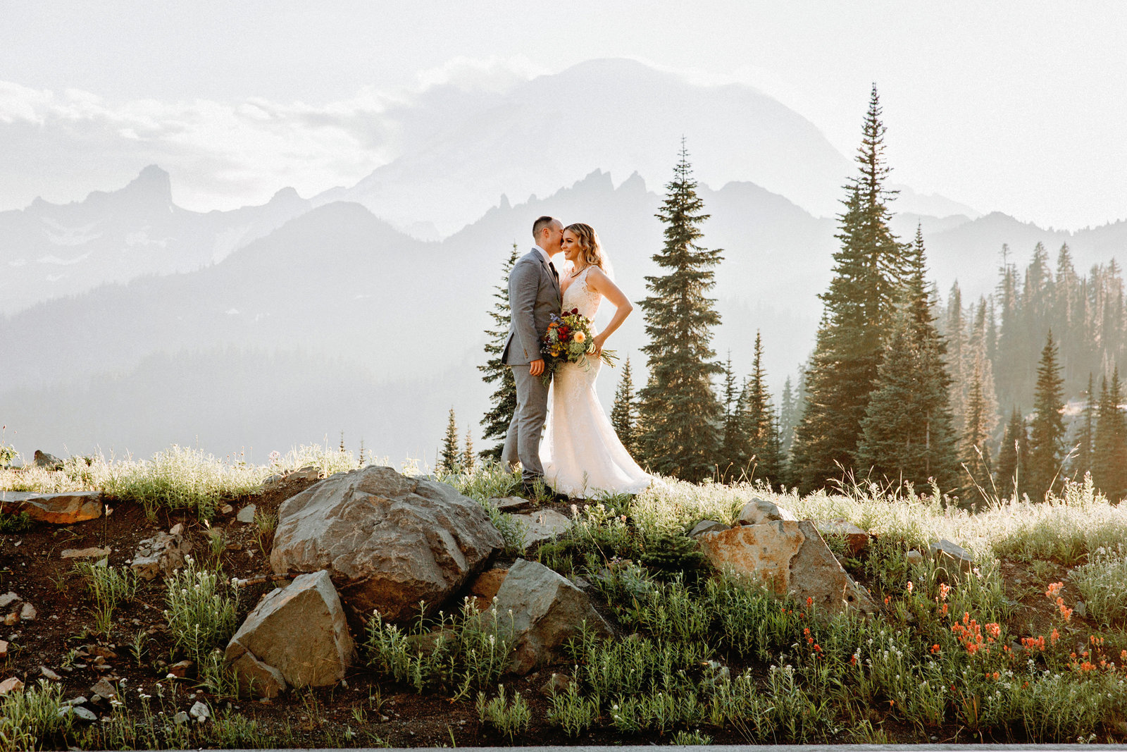 bride and groom standing in Washington mountains to elope