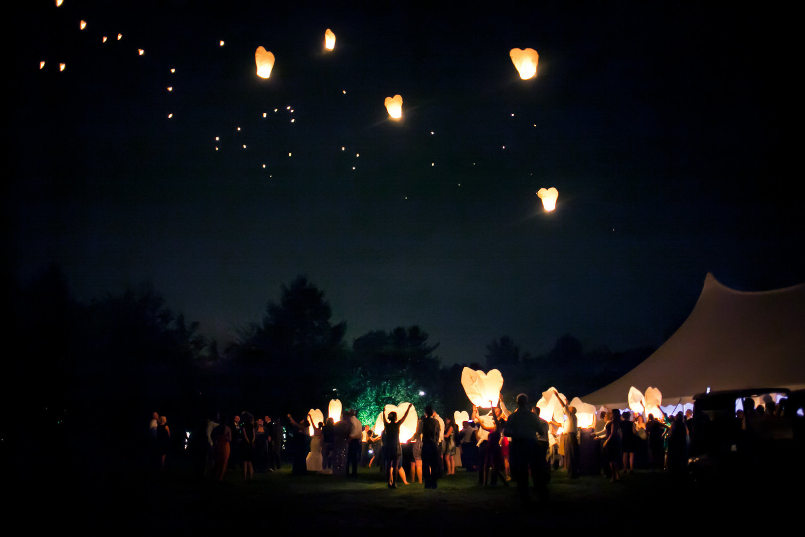 Incredible shot of a lantern release during the reception at this Philadelphia wedding.