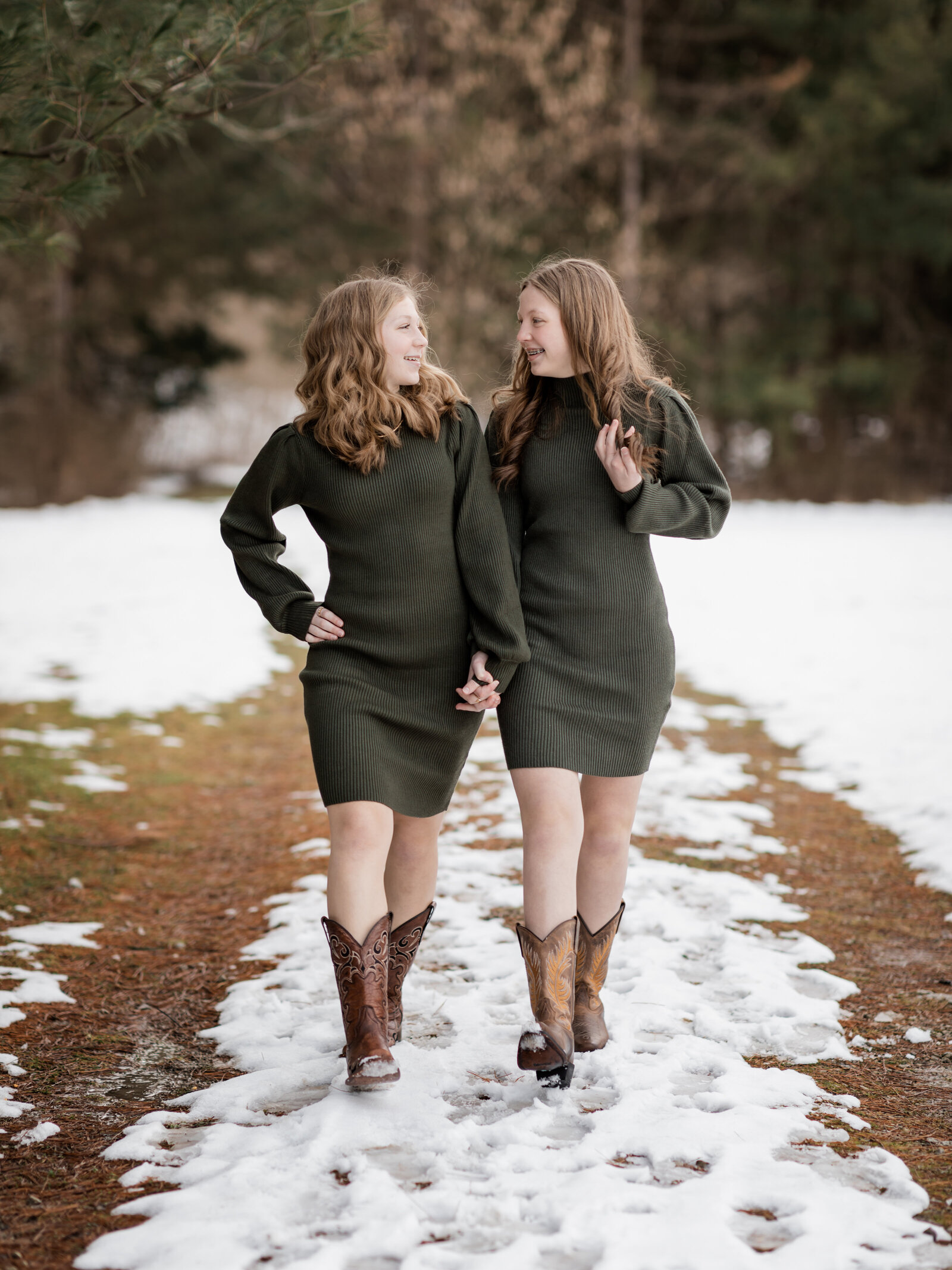 two sisters walking for family photos