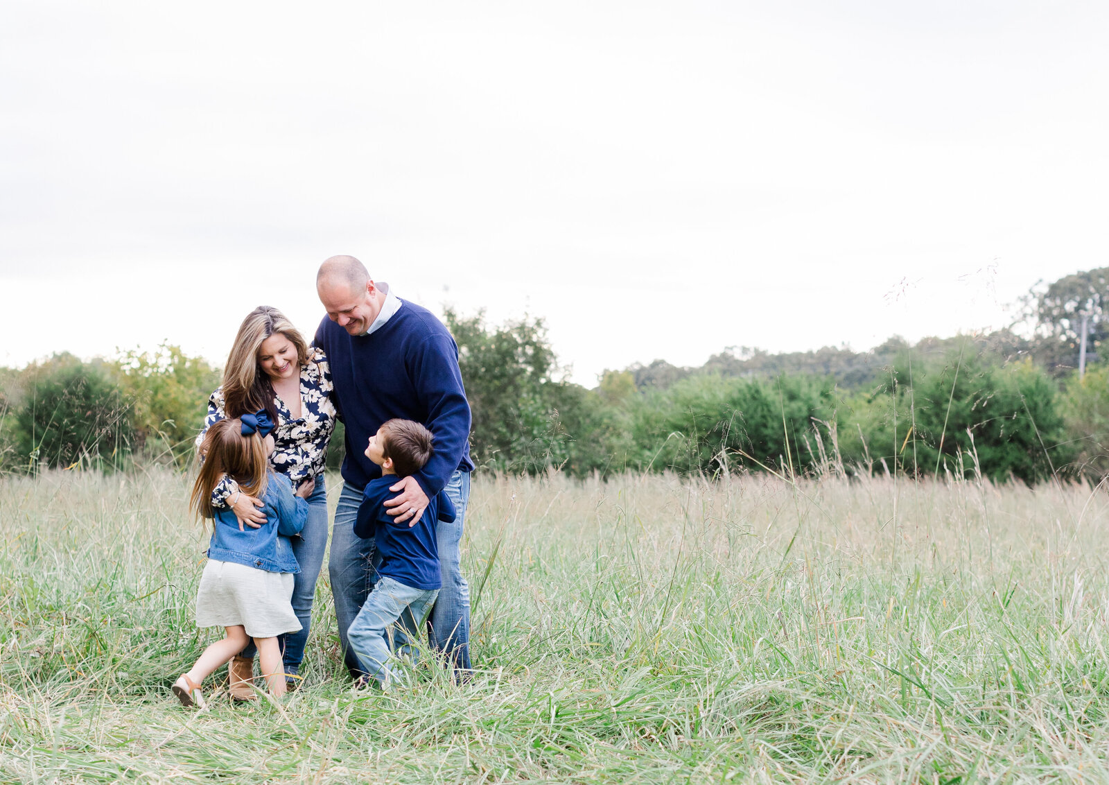 family hugging during fall mini session in Chattanooga