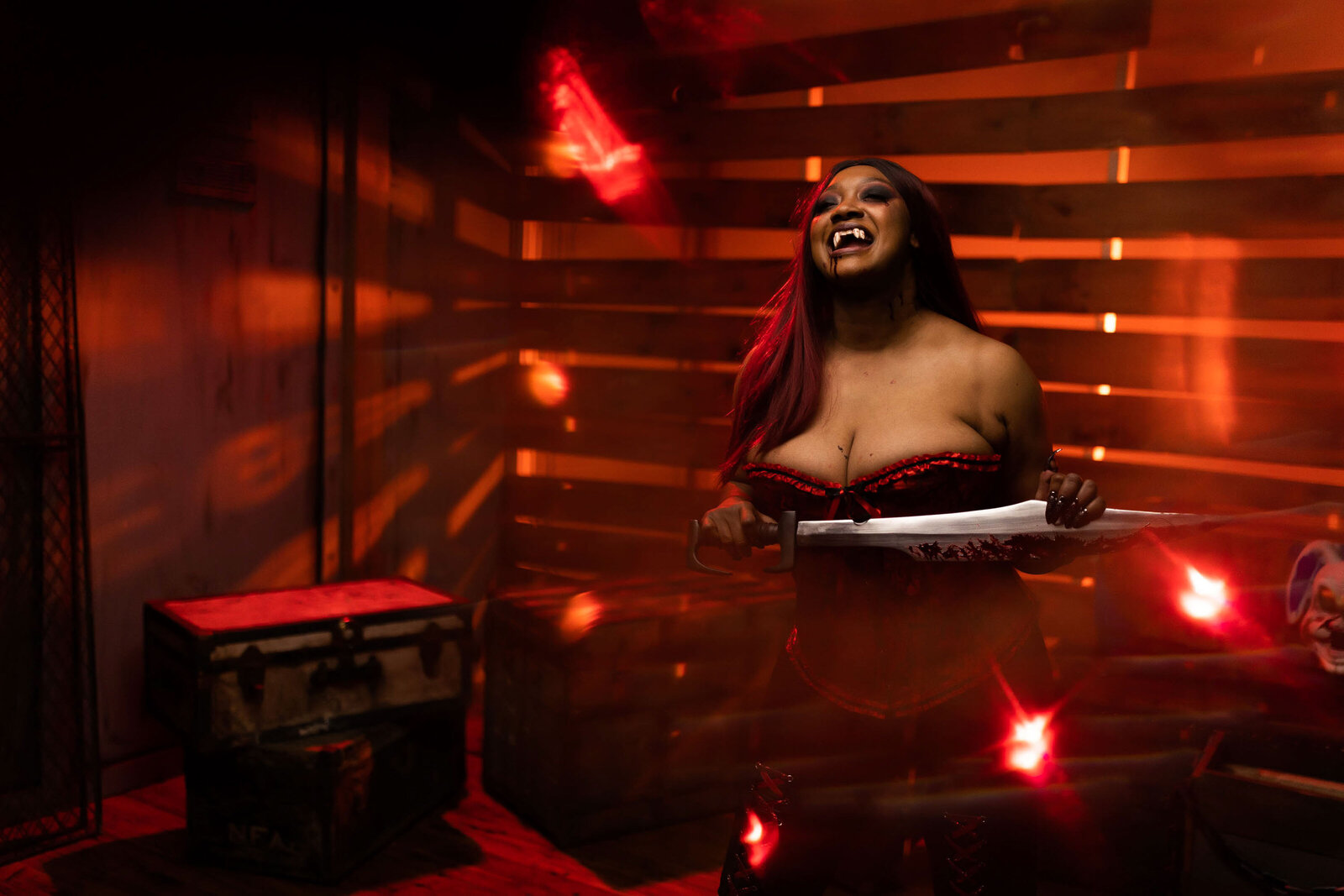 woman in a vampire makeup holding a machete
