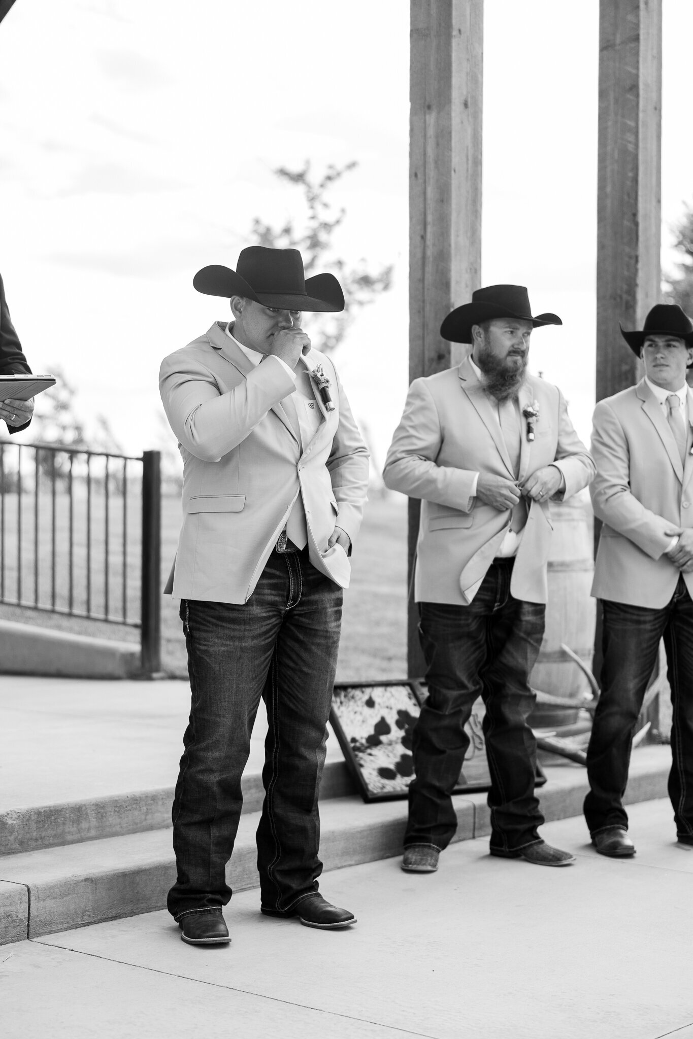 Emotional moment as groom wipes away a tear seeing his bride walk down the aisle at a Loma, Colorado wedding
