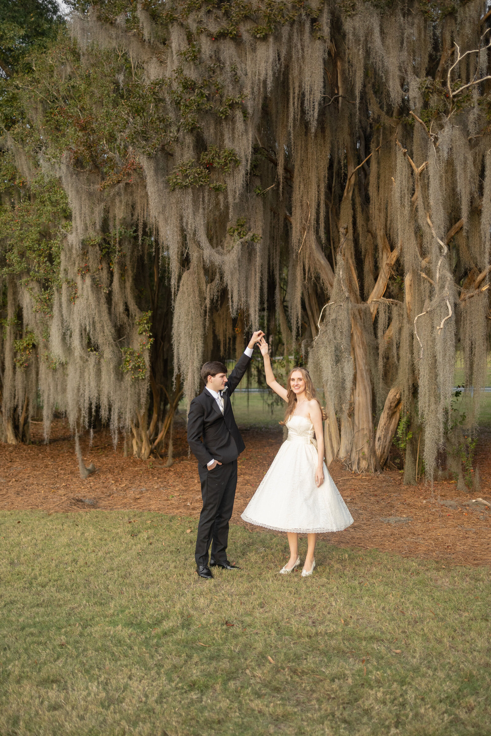 bride-at-groom-smiling-at-sunset-National-Infantry-Museum-Amanda-Richardson-Photography