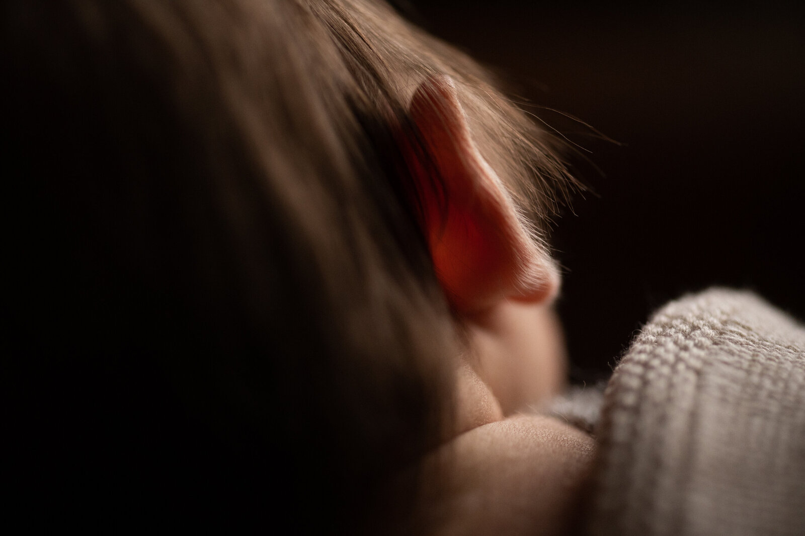 Close up of a newborn baby ear.