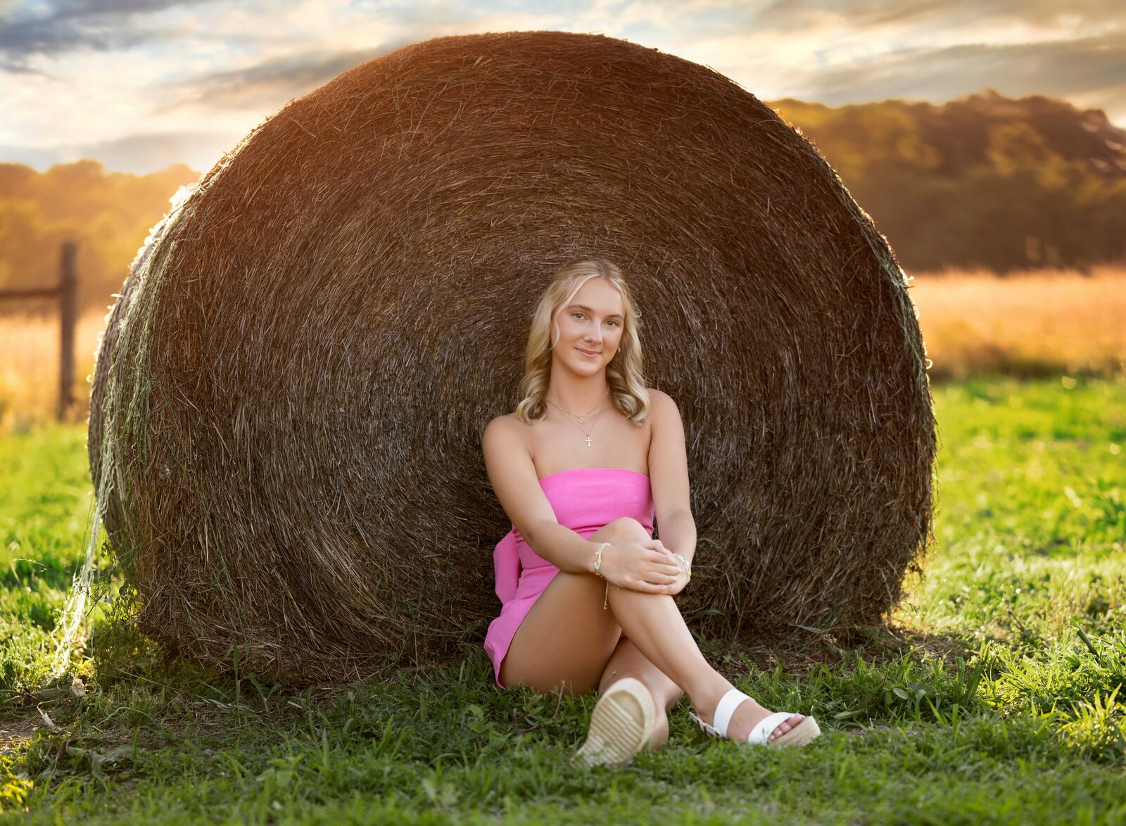 Girl taking senior photos on a farm in Atlanta. Graduation photos taken by Jenni Nikki Photography in Atlanta, GA