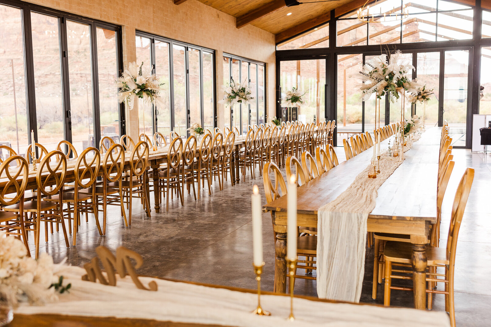 Red Earth Venue- Tables and chairs - with table cloths and centerpieces before wedding day 