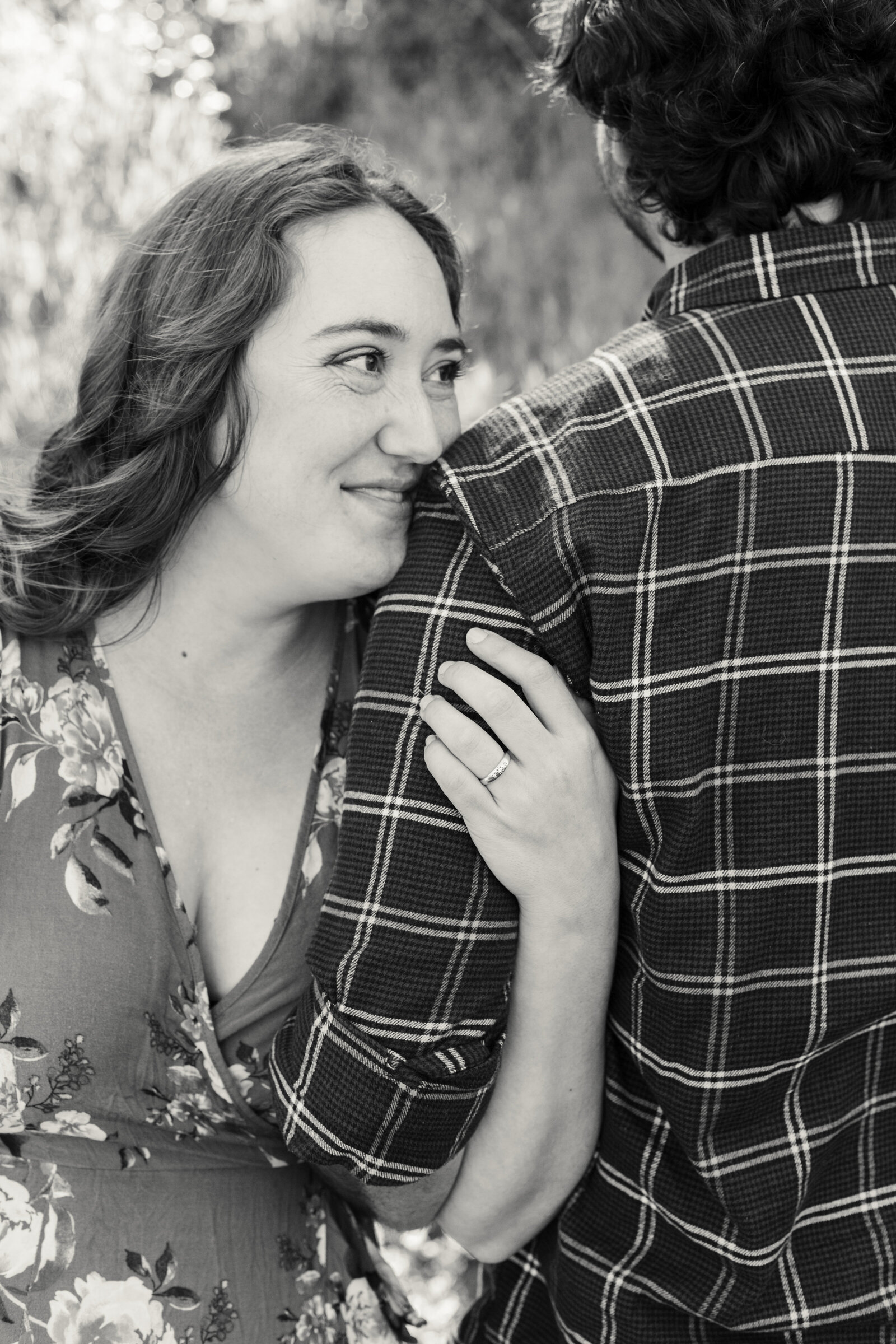 An engaged couple poses for photos in a garden in Los Angeles, Ca.