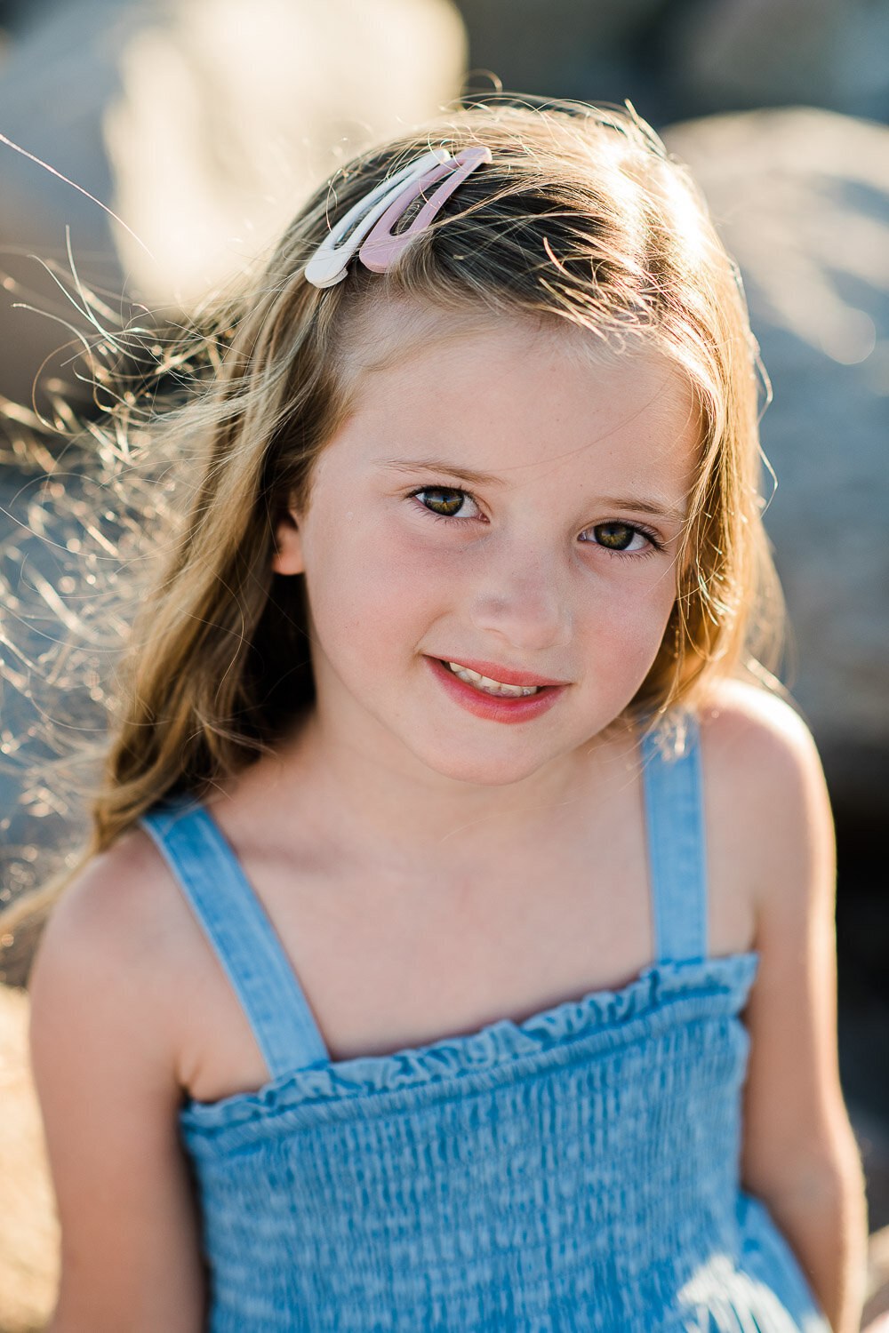 young girl in sunlight at beach